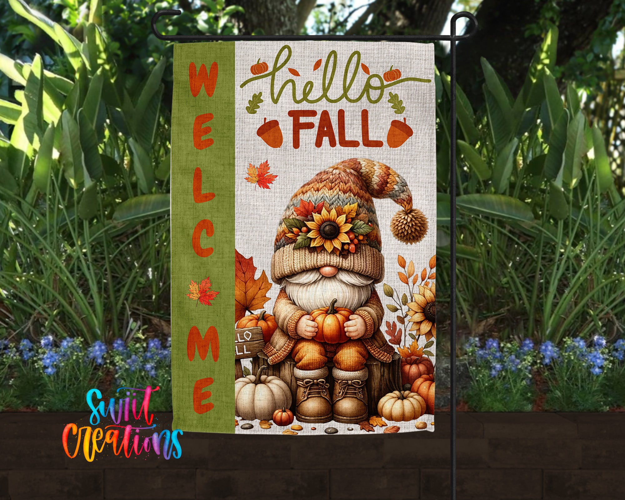 A garden flag featuring a gnome holding pumpkins and autumn leaves, with the text "WELCOME FALL" displayed prominently.