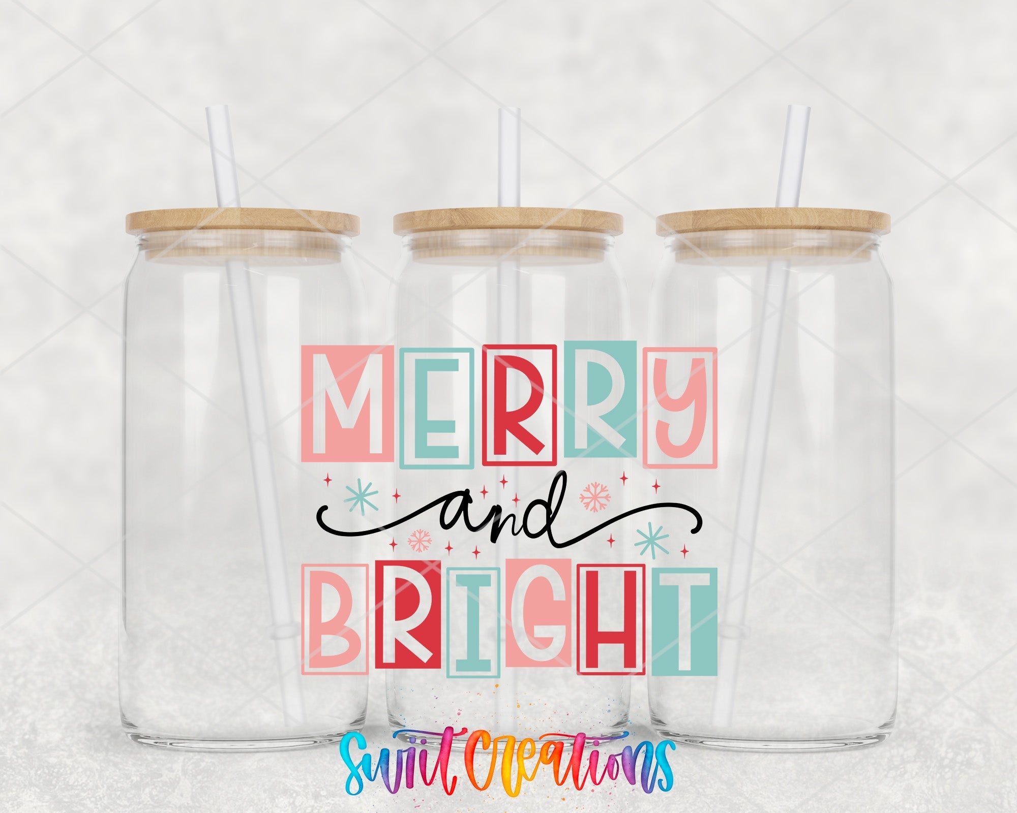two clear tumblers with merry and bright lettering