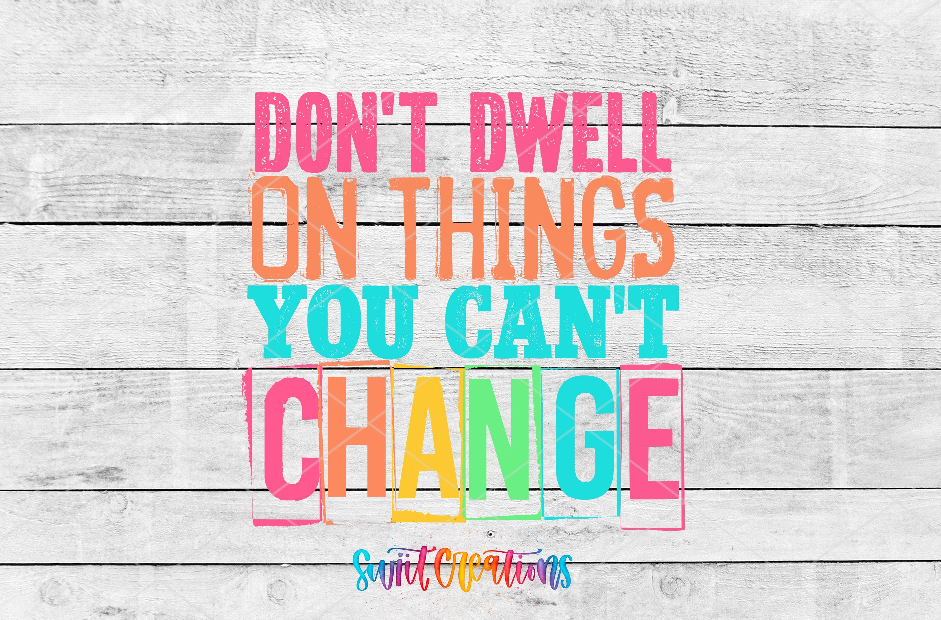 a colorful quote on a white wood background