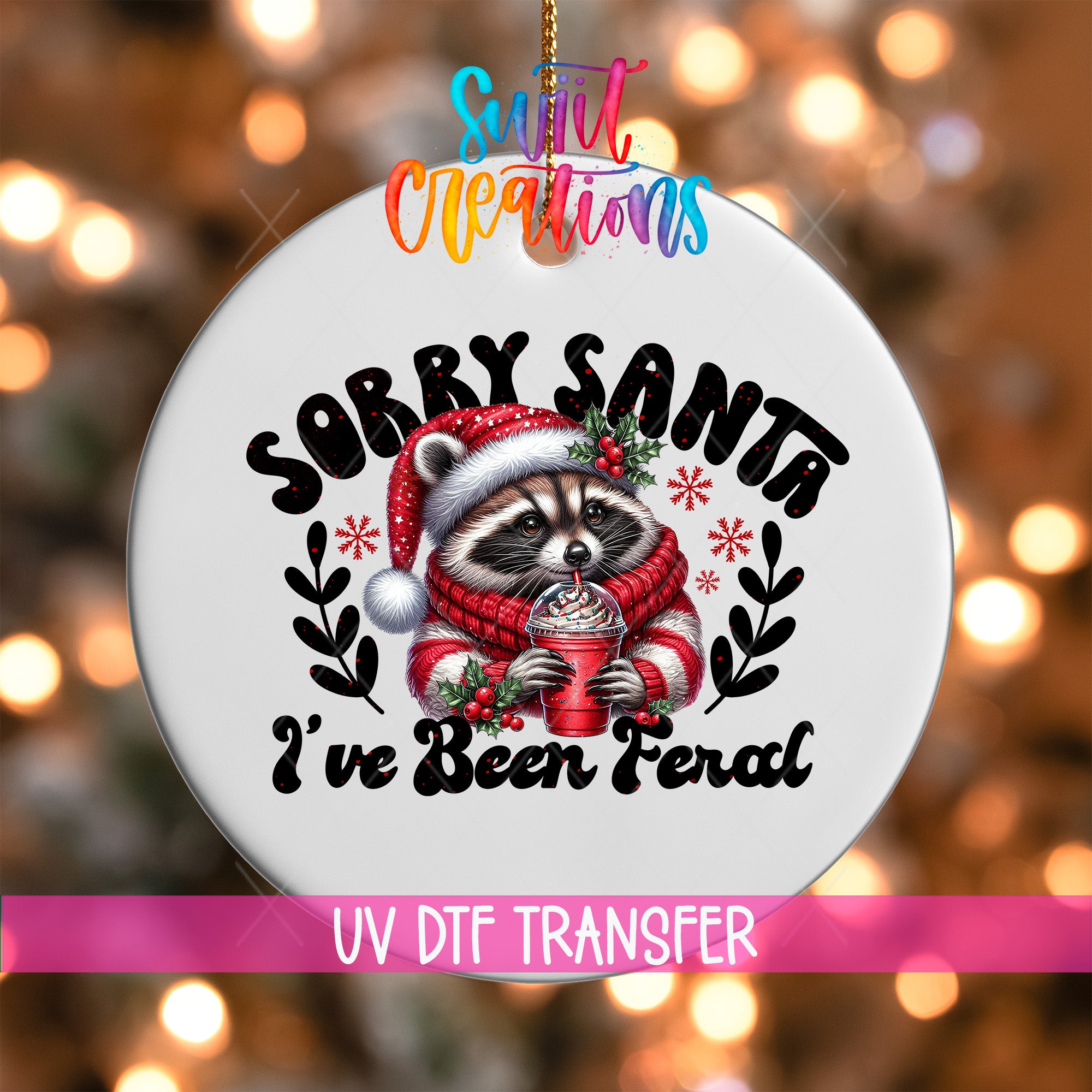 A white ornament with a raccoon wearing a Santa hat and scarf, holding a drink, and the text "Sorry Santa I've Been Feral" printed on it.