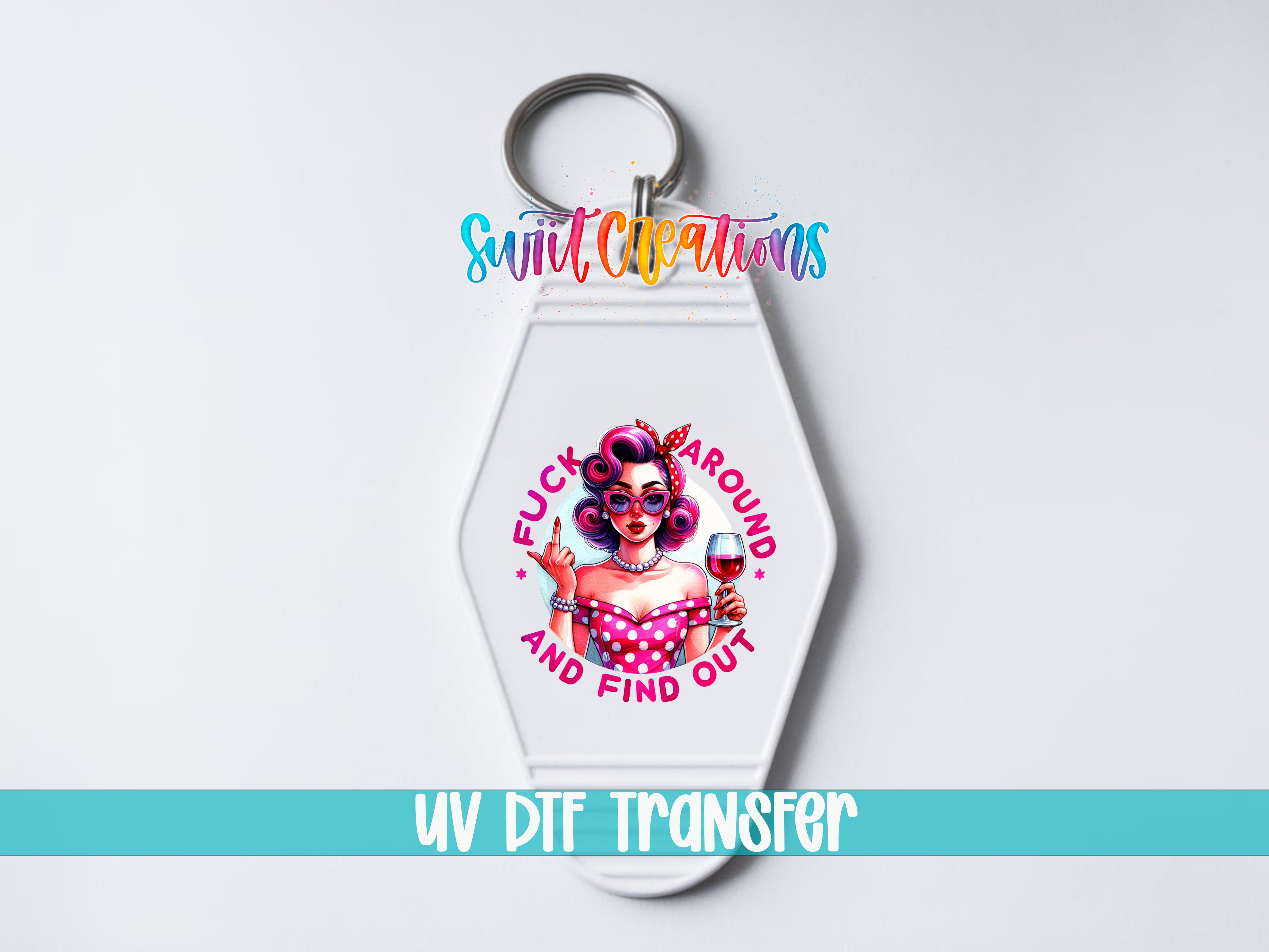A keychain with a colorful design featuring a woman with curly hair and a pink polka dot dress, along with the text "FUCK AROUND AND FIND OUT" and "UV DIF TRANSFER".