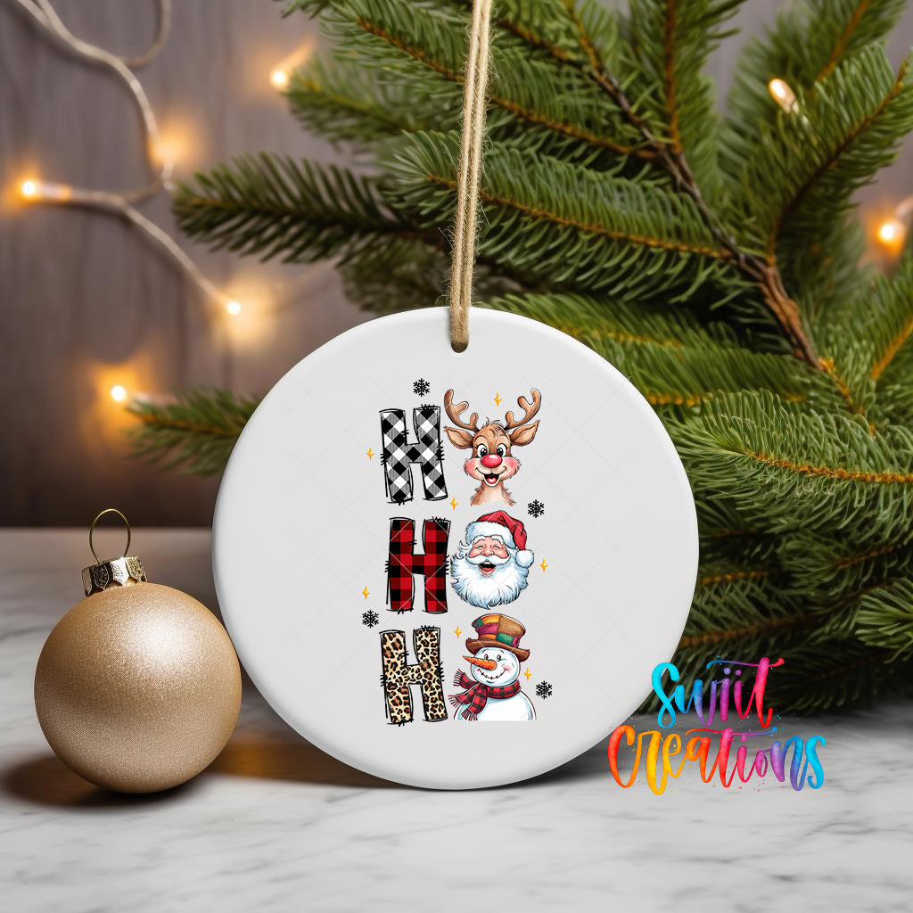 A white ceramic ornament with the word "HAPPY" written on it, surrounded by various Christmas-themed illustrations such as a reindeer, Santa Claus, and a snowman.
