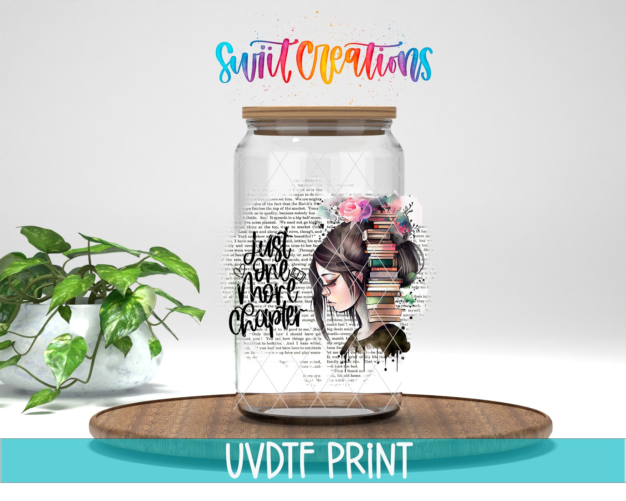 a glass jar with a printed design of a woman's face and the text "Just one more chapter" on it, placed on a wooden surface. There is also a potted plant in the background.