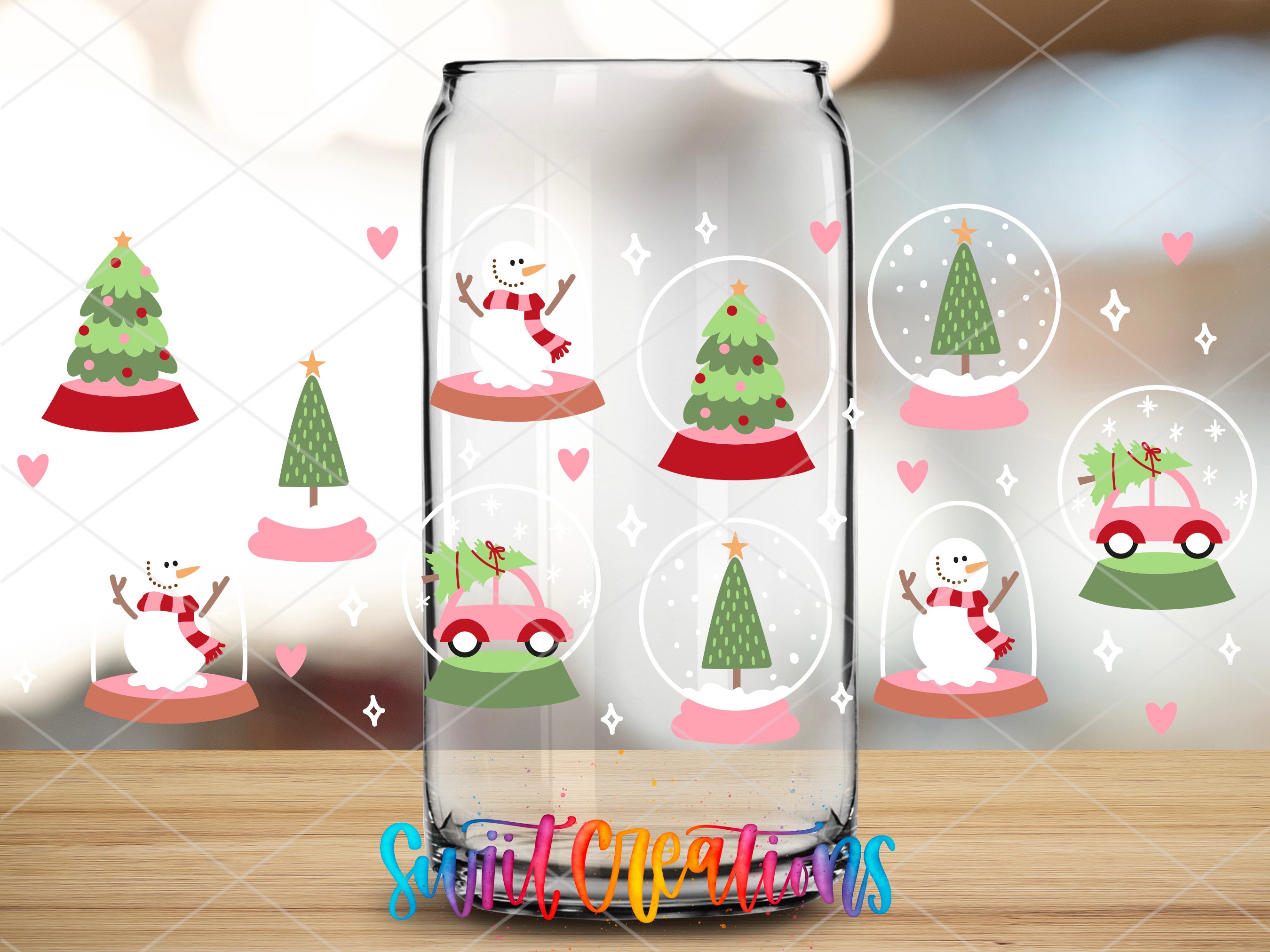 a glass jar with a snowman and a christmas tree inside of it