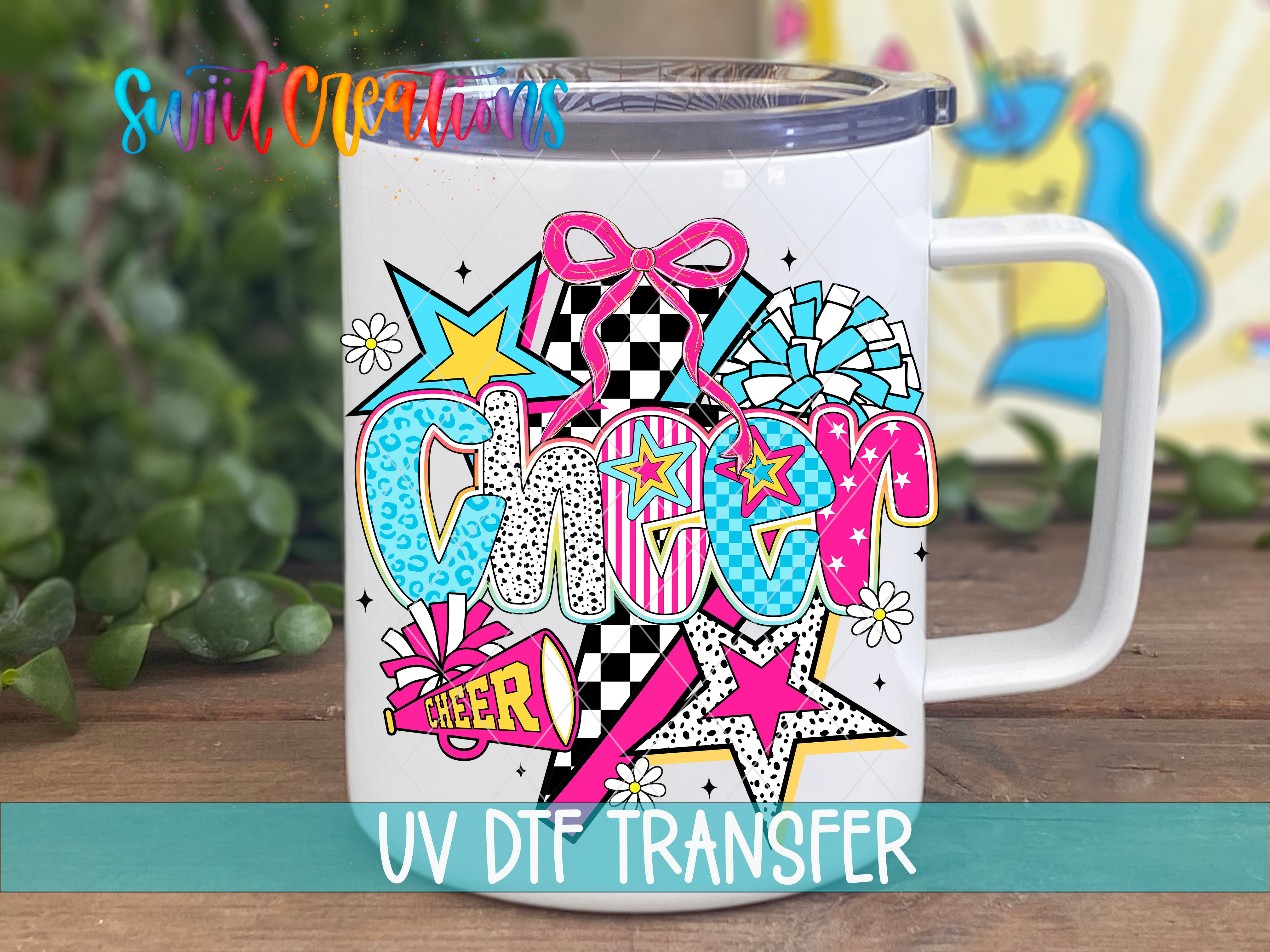 A white mug with a colorful, vibrant design featuring the word "Cheer" surrounded by various shapes, stars, and other decorative elements.
