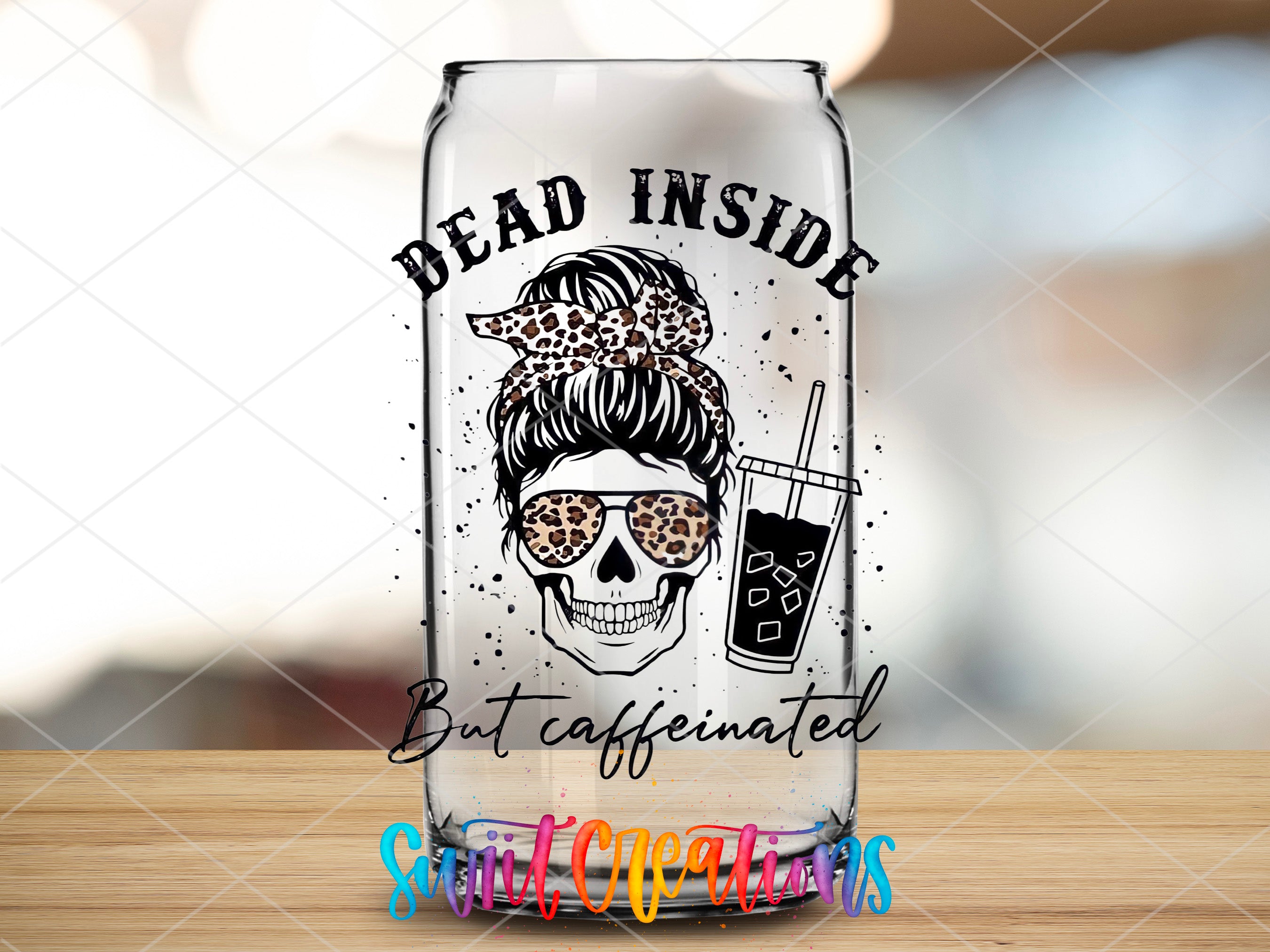 a glass with a picture of a woman with a skull on it