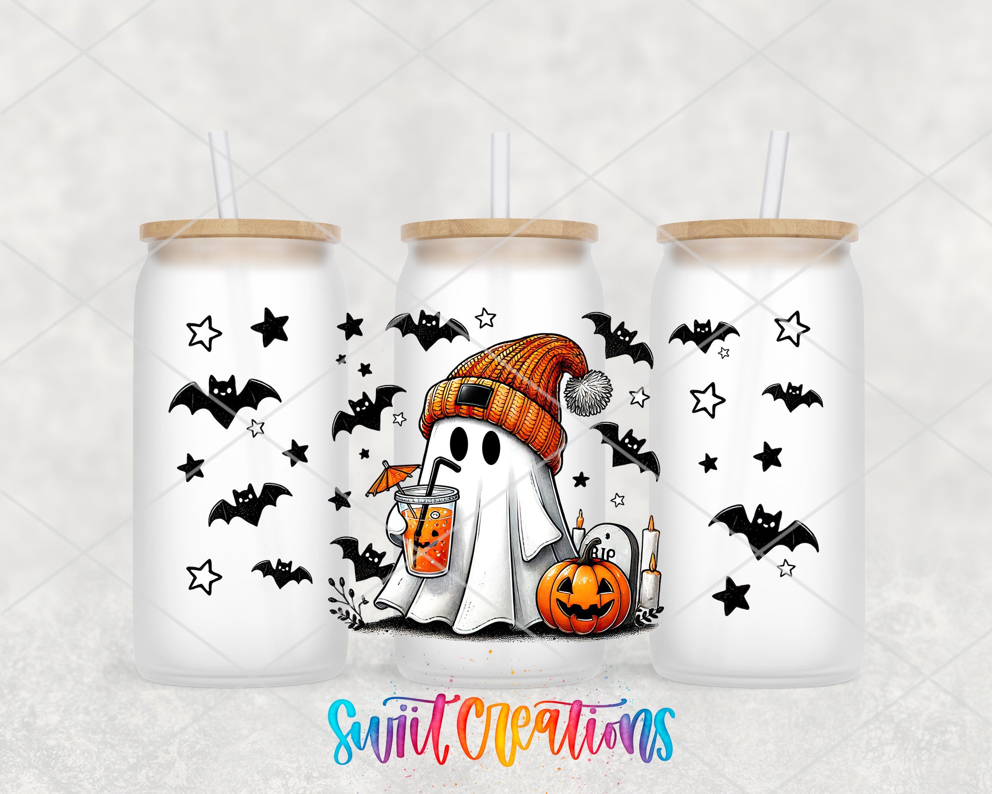 A trio of white tumblers with Halloween-themed designs, including a ghost, bats, pumpkins, and stars.