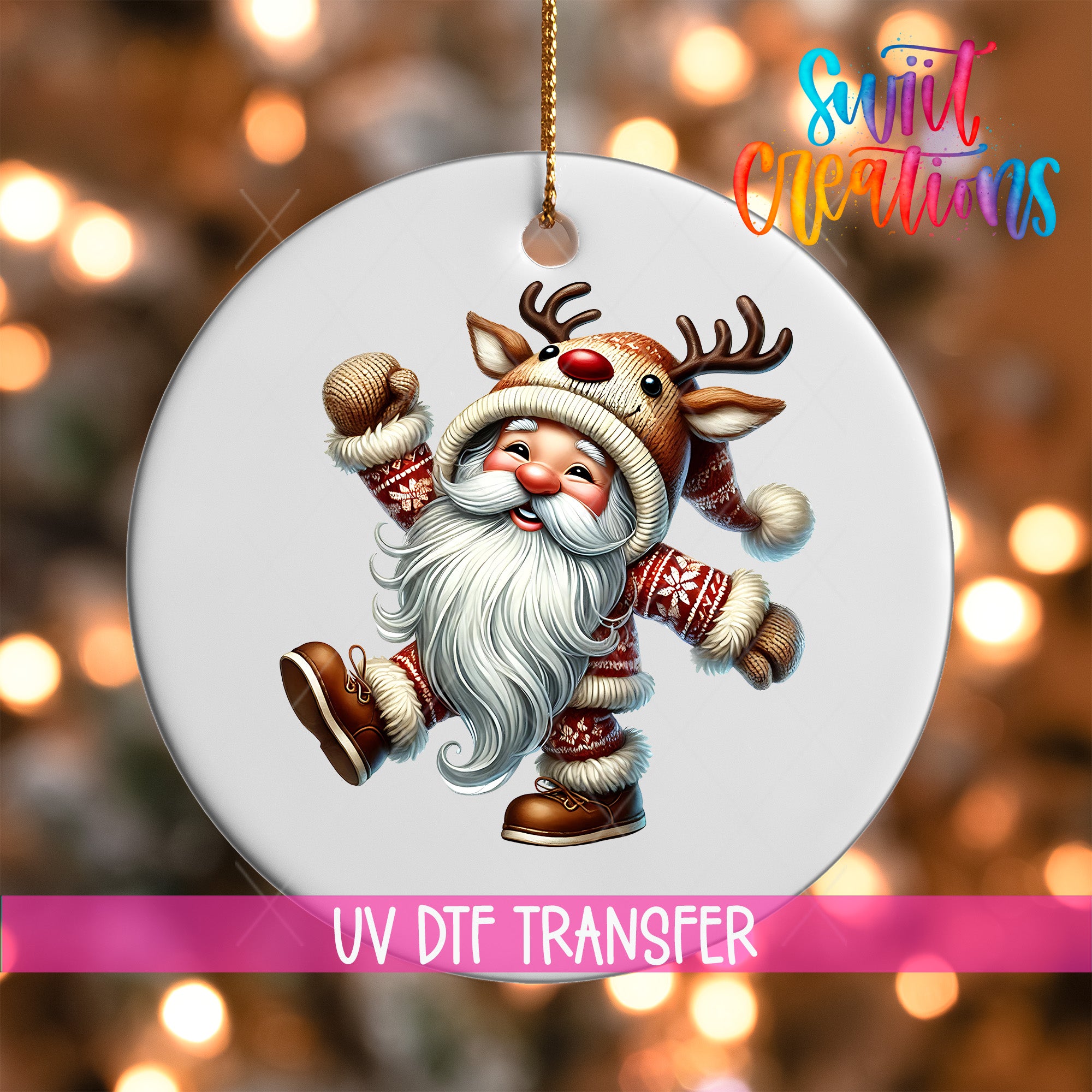 A white ornament featuring a smiling reindeer character wearing a Santa hat and coat, with a pink ribbon around it.
