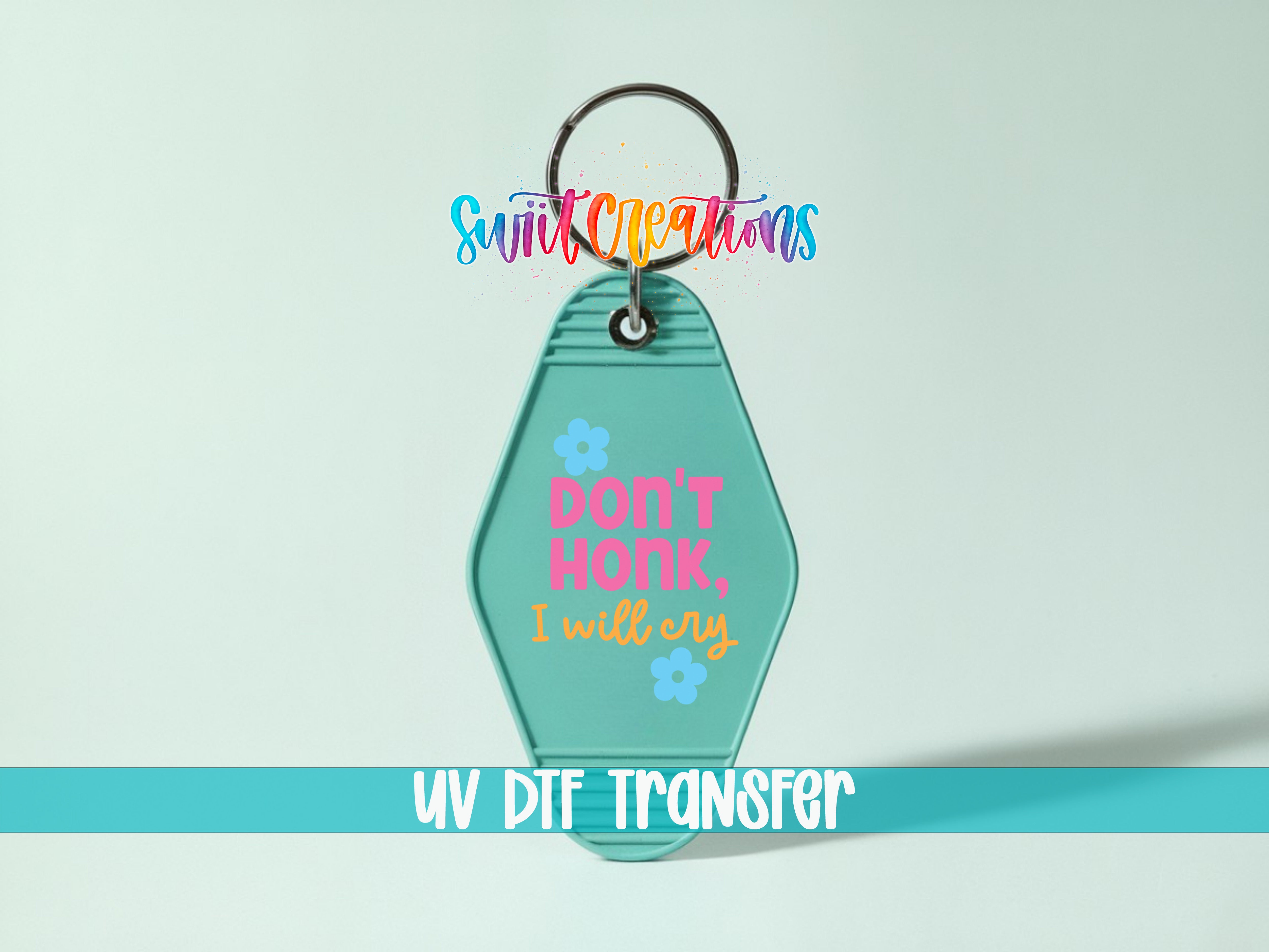 A keychain with a message printed on it, along with a UV DIF transfer label.