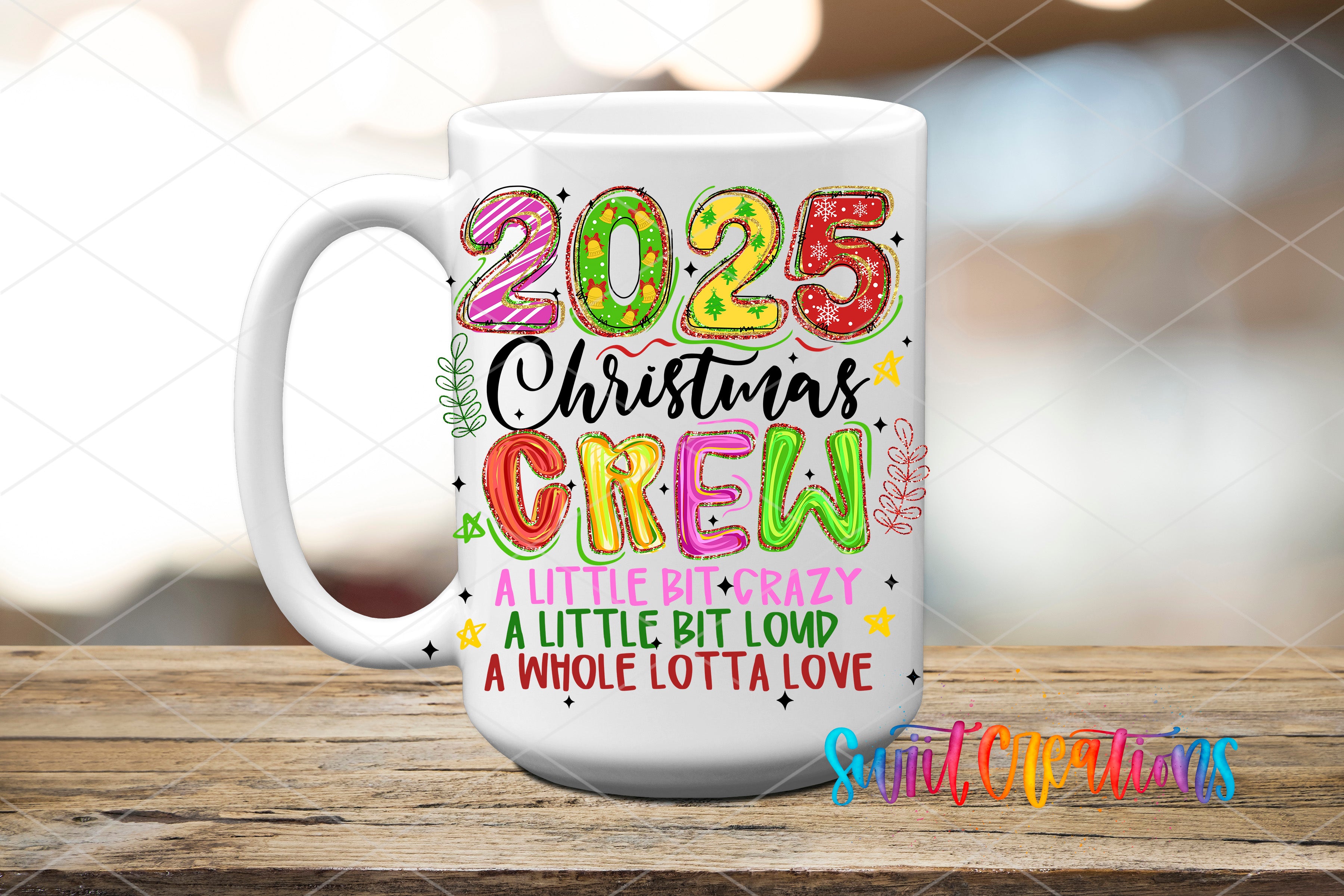 A white ceramic mug with colorful text and graphics on it, placed on a wooden surface.