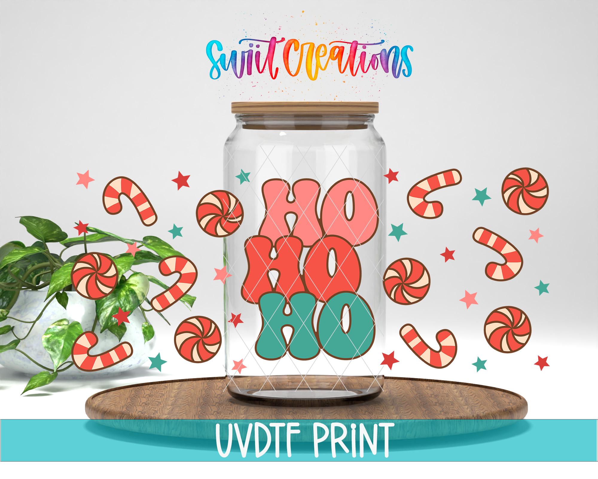 a jar filled with candy canes sitting on top of a table