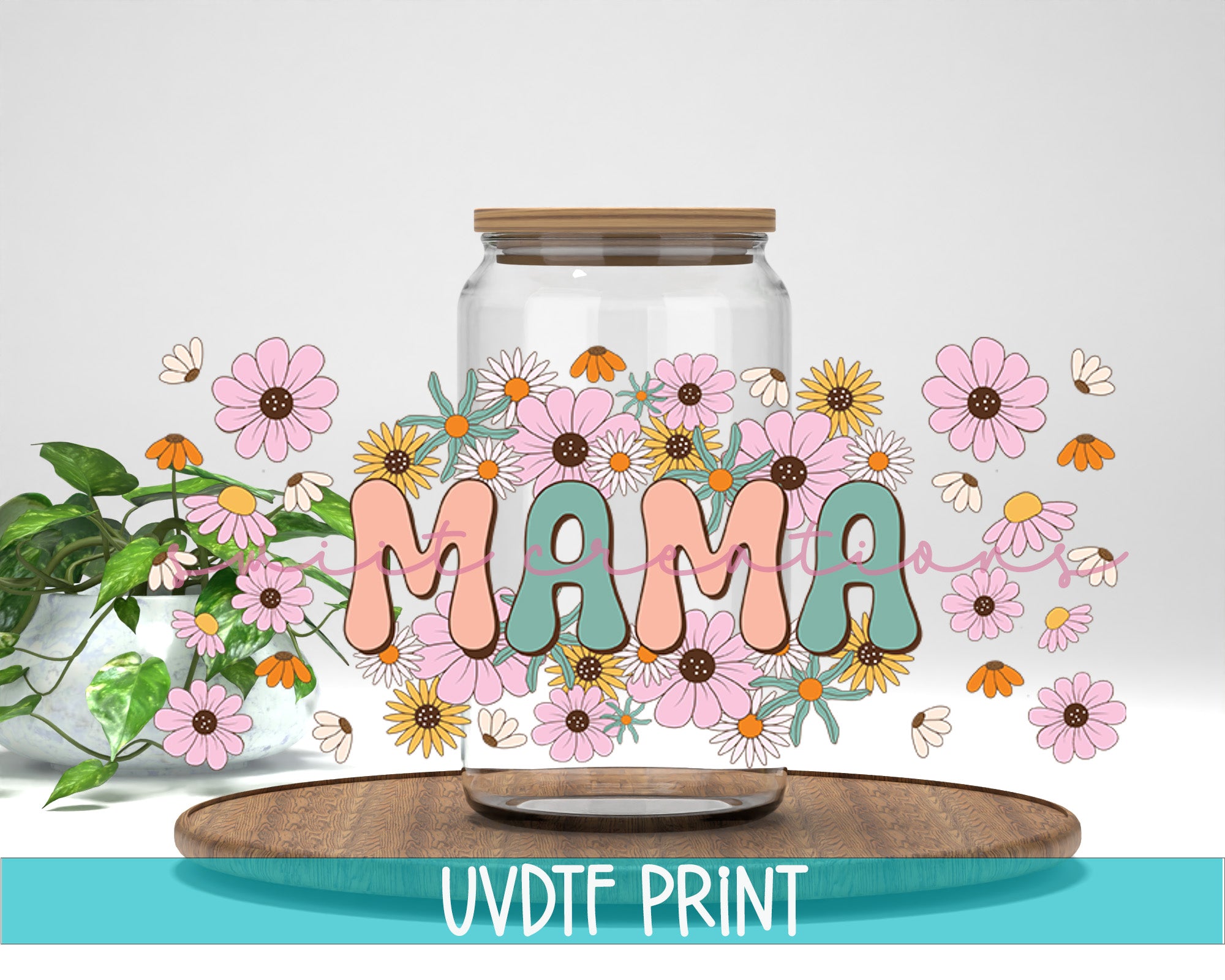 a glass jar filled with flowers next to a plant
