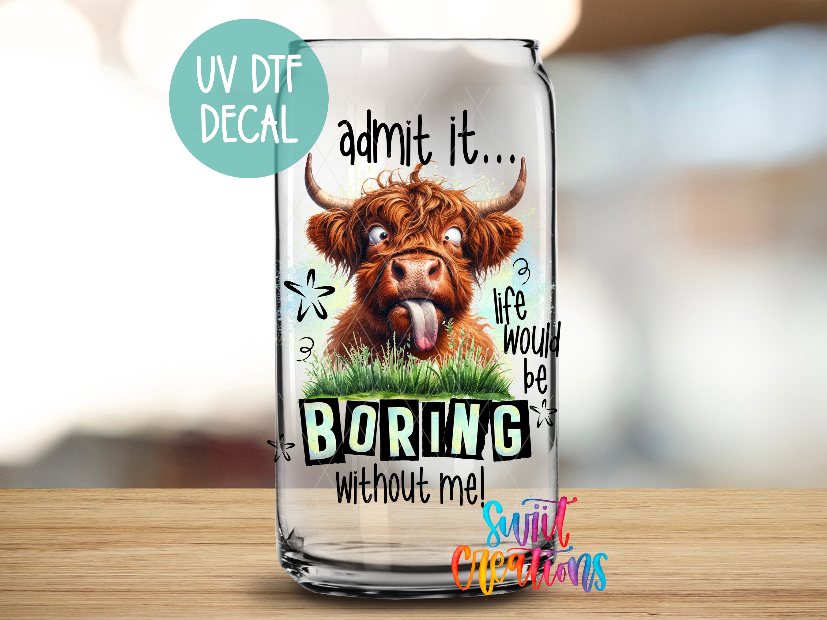 a glass with a picture of a cow sticking its tongue out