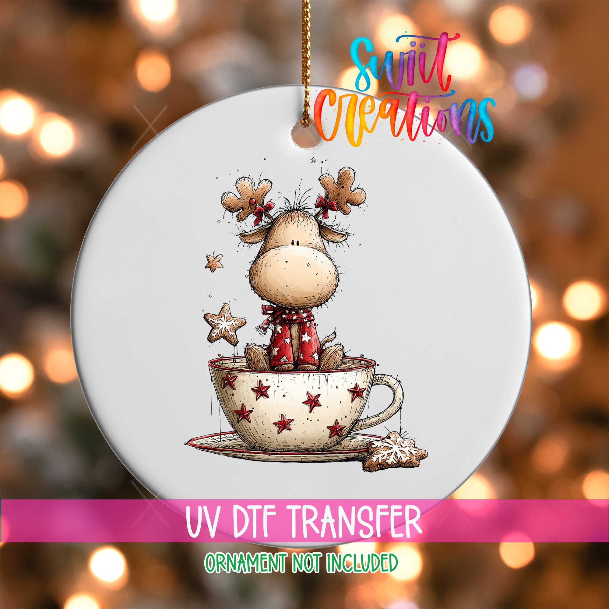 A white ornament with a cartoon image of a reindeer sitting in a cup of stars, surrounded by Christmas lights.