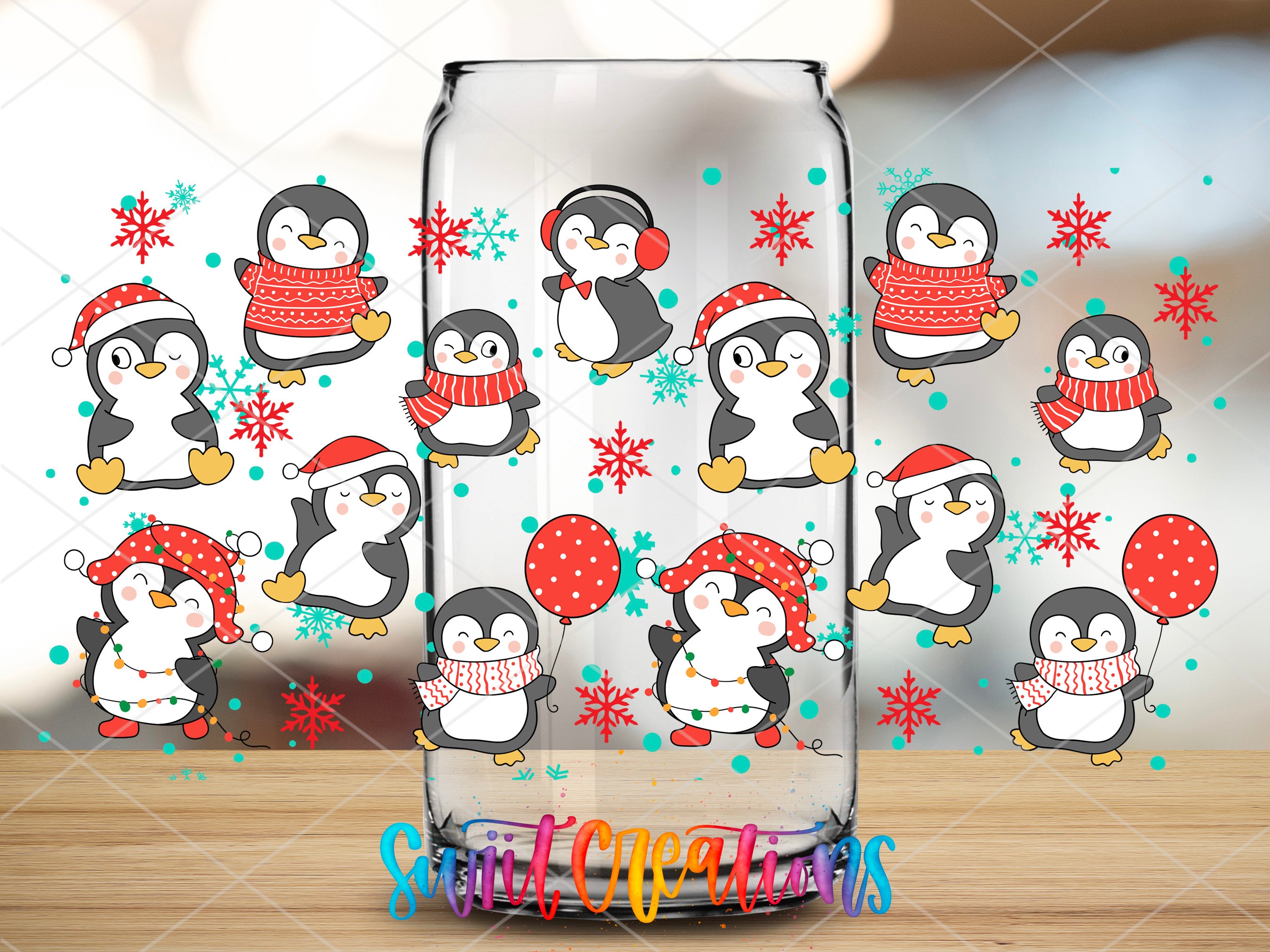 a glass vase with penguins and snowflakes on it