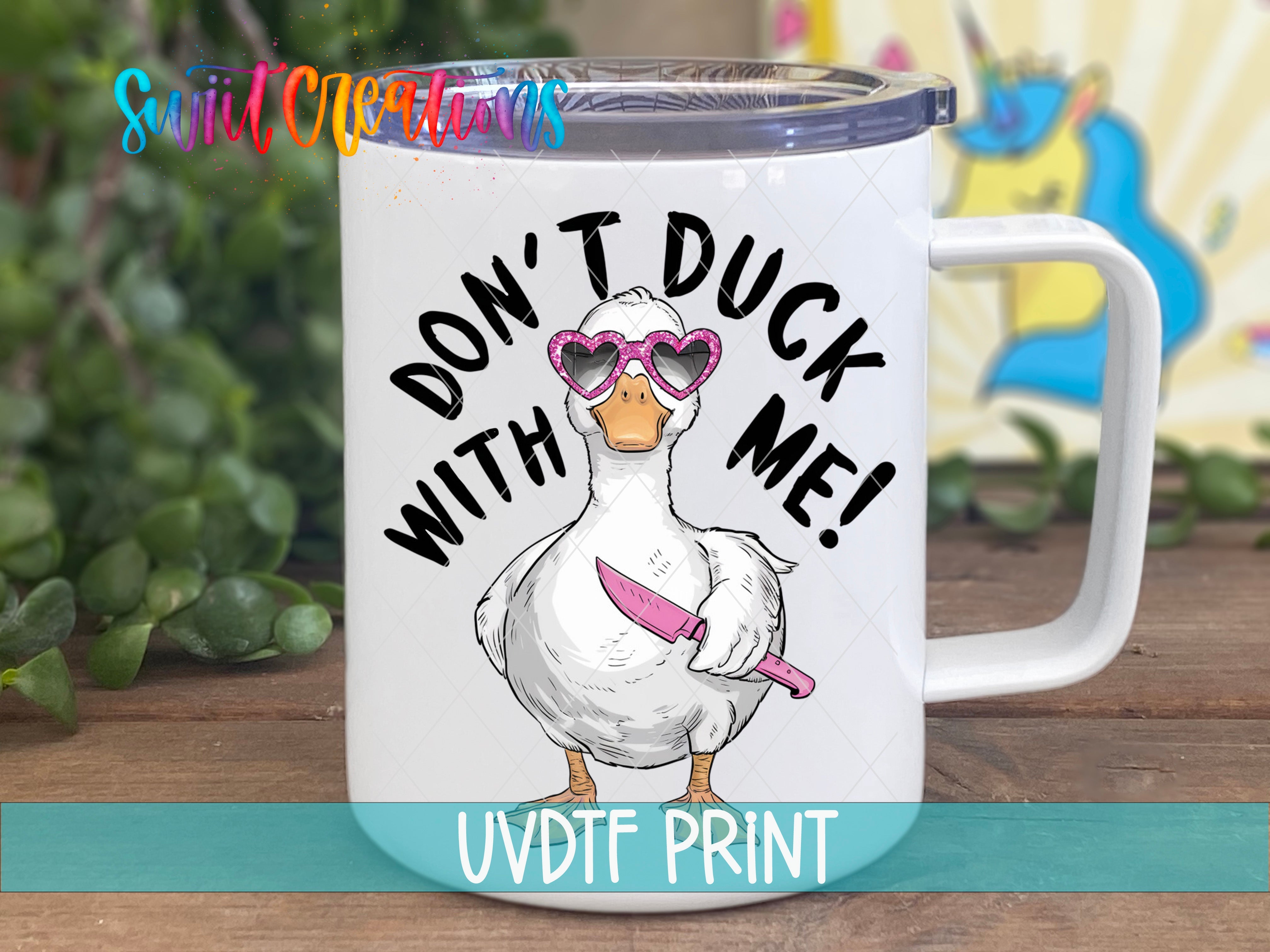 a white coffee mug with a duck wearing sunglasses