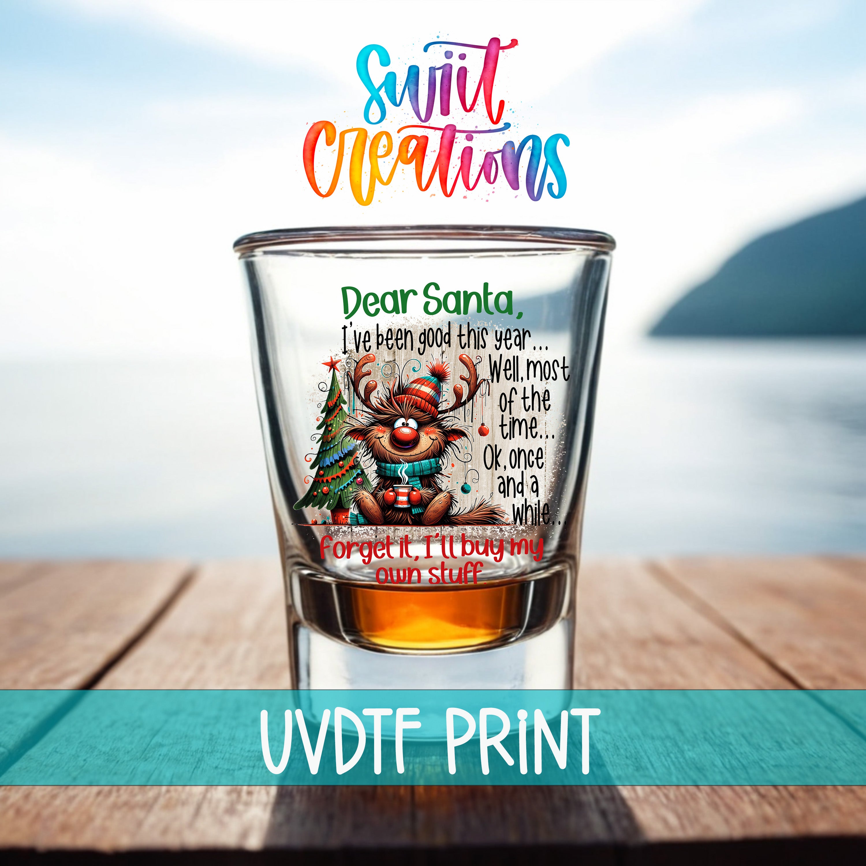 a shot glass with a Christmas-themed design, including a reindeer and a Christmas tree, along with a handwritten message addressed to Santa.