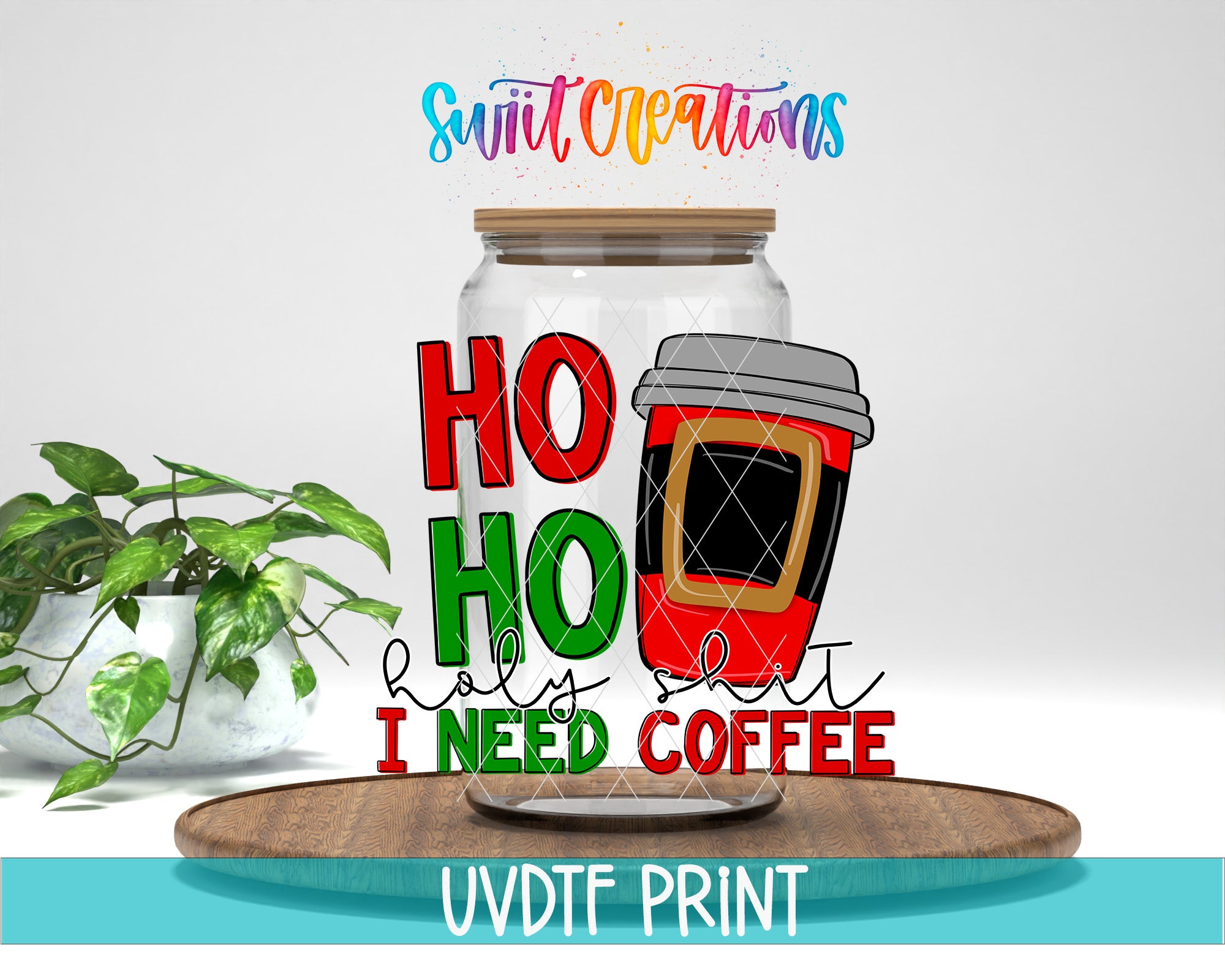 A glass jar with a coffee cup inside, along with the text "HO HO holy shit I need coffee" and "Swift Creations" written above it. The jar is placed on a wooden surface, and there is a potted plant in the background.