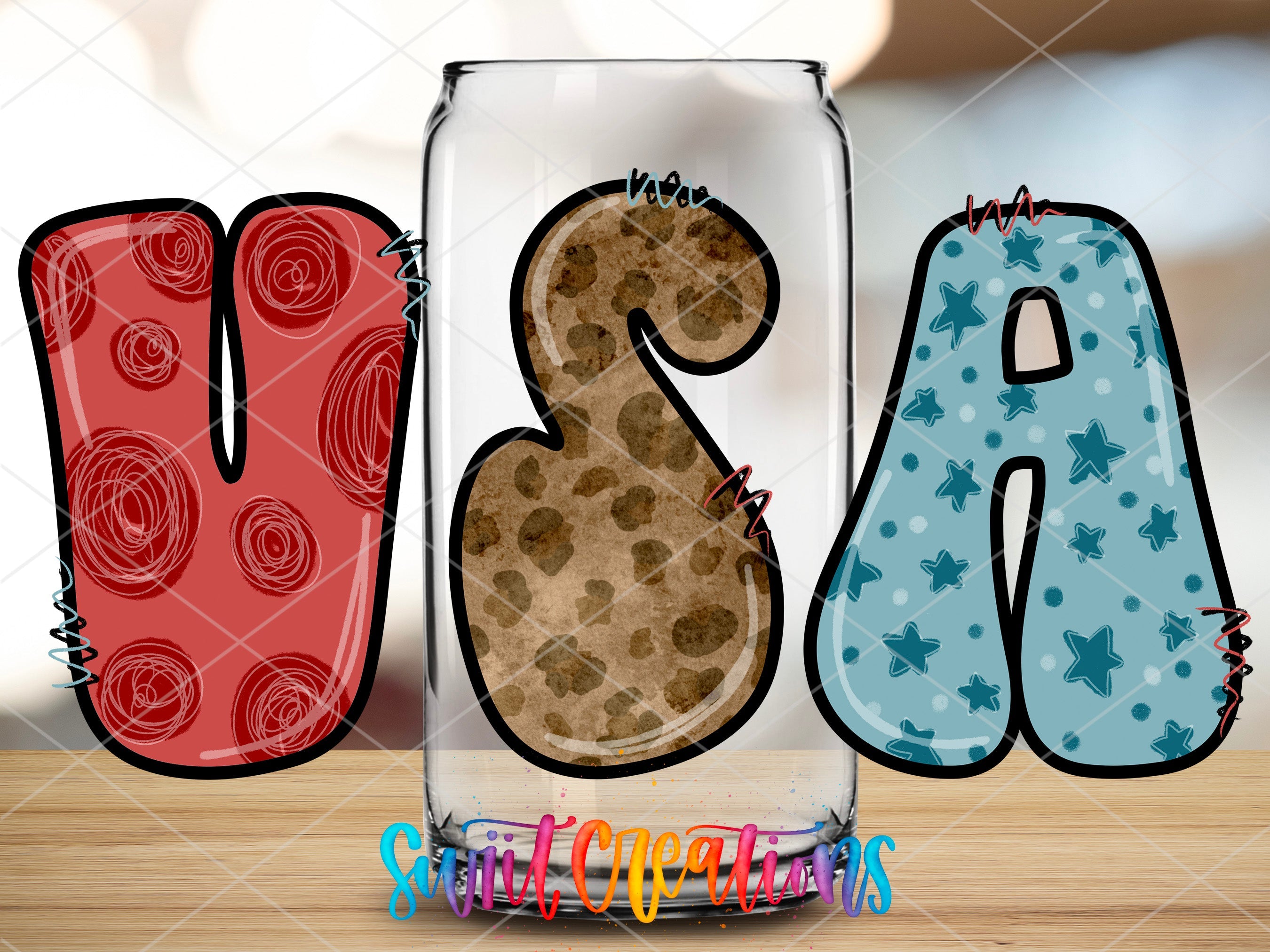 a glass with a cookie in the shape of the letter b and a cookie in