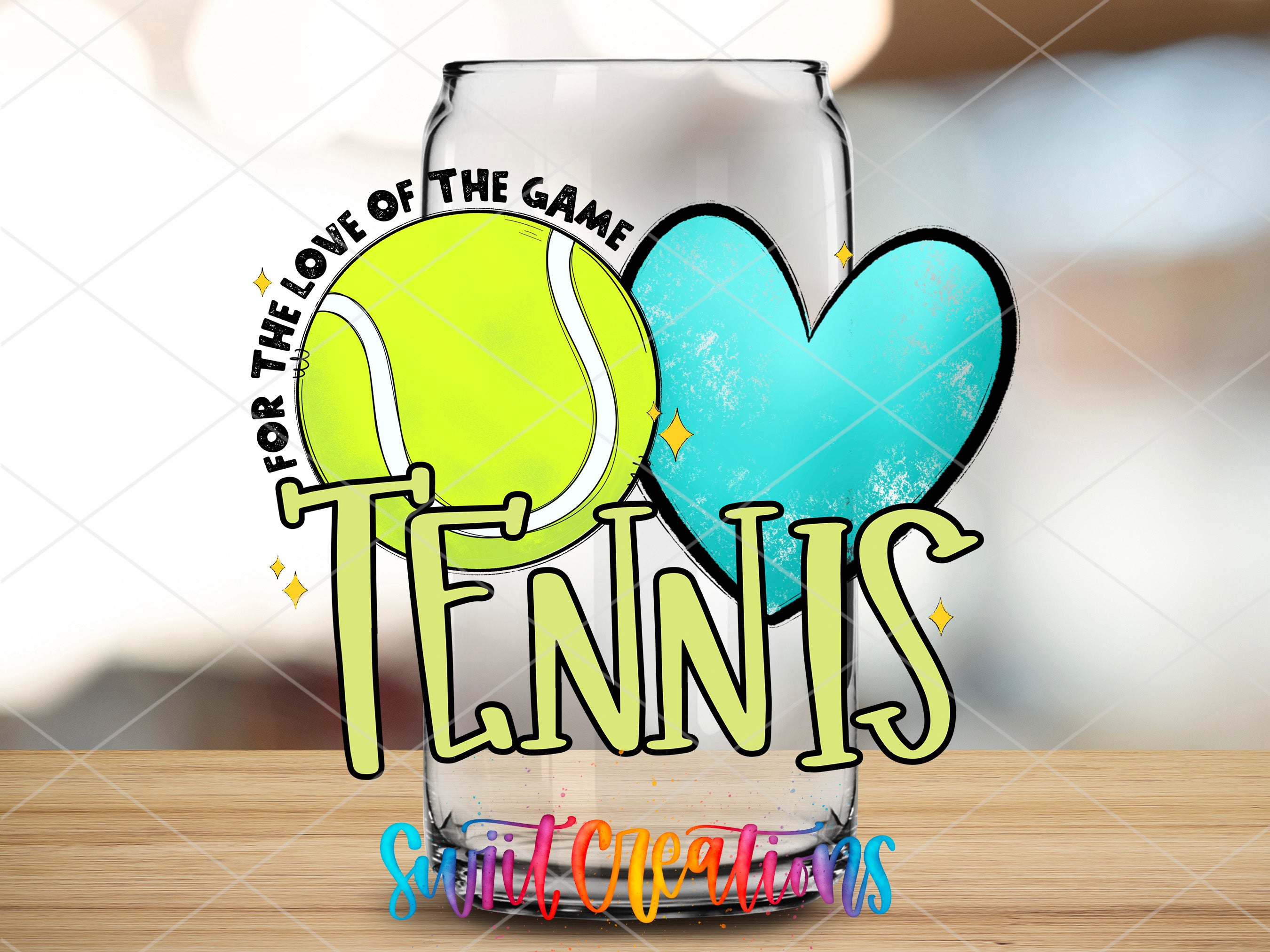 a glass with a tennis ball inside of it