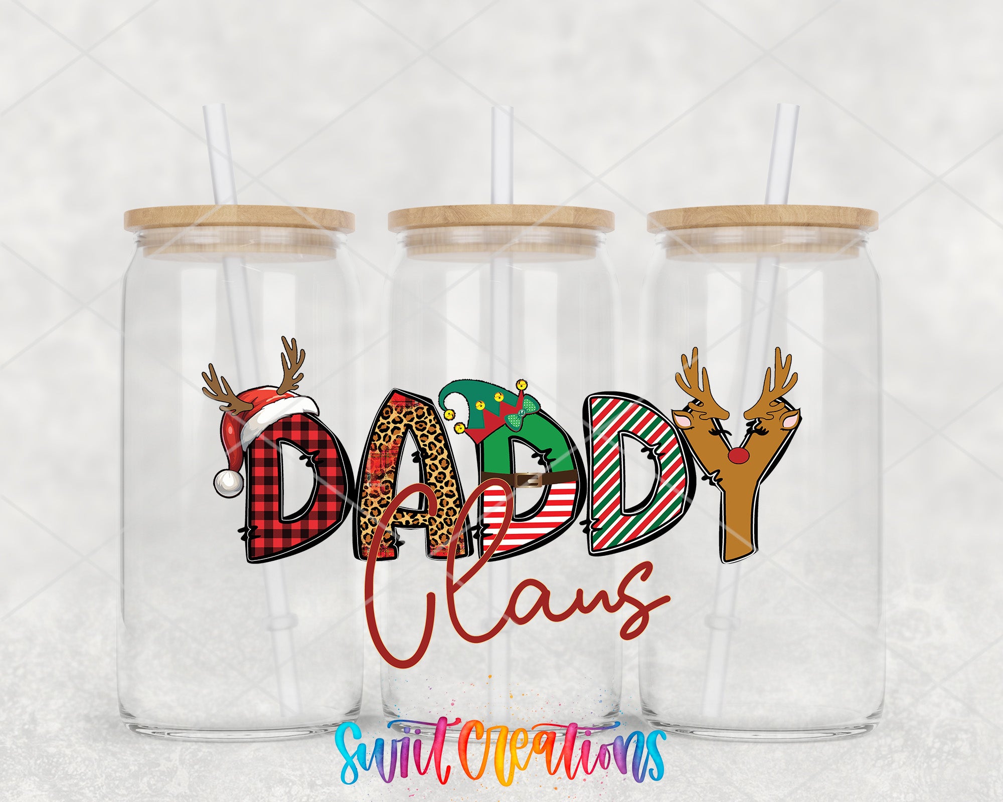 a couple of glass cups with christmas decorations on them