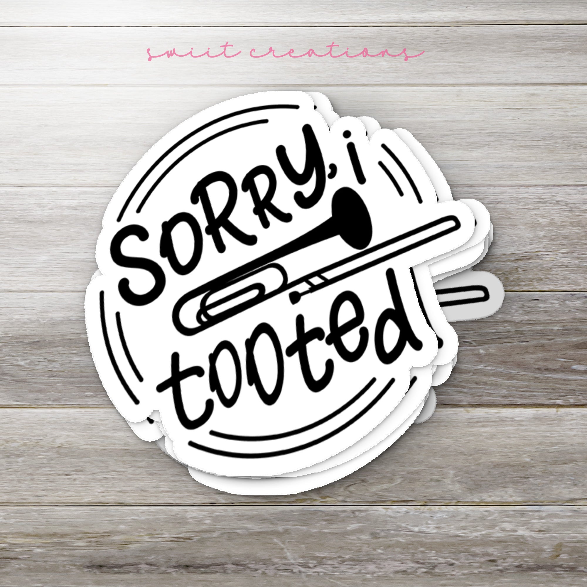 a sticker that says sorry tooted on it