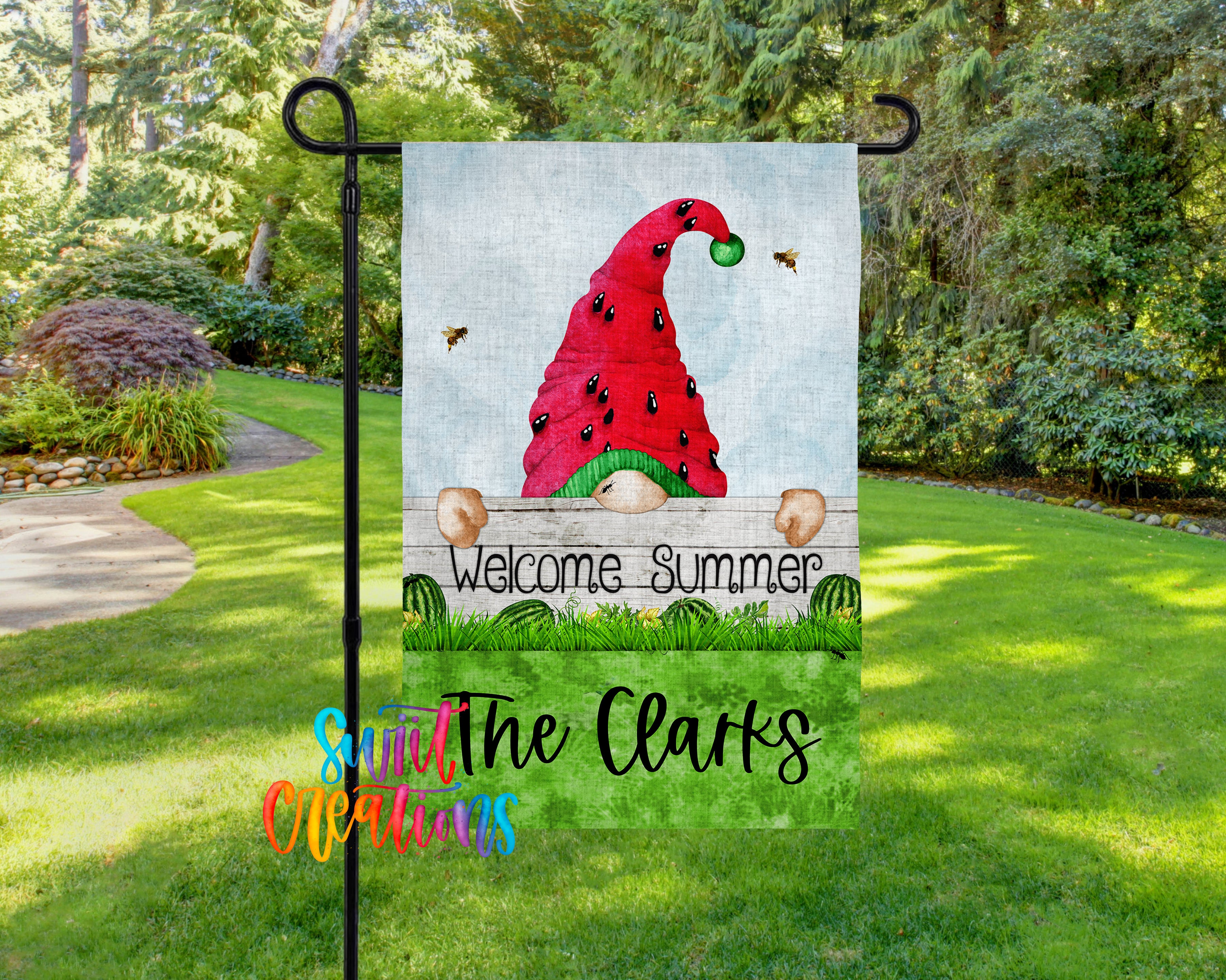 A garden gnome sign with a red hat and a green ball, surrounded by a grassy area with trees in the background.
