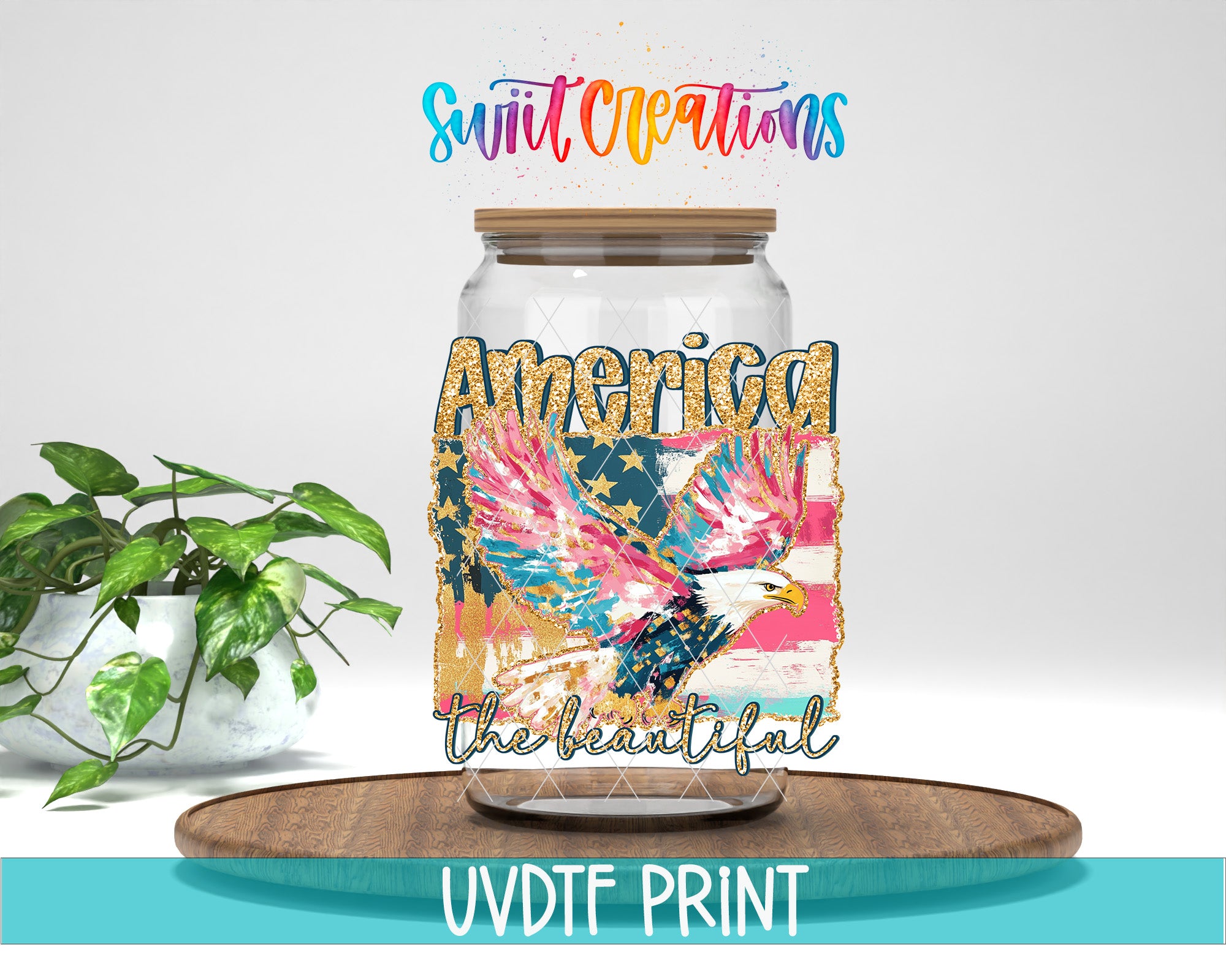 a glass jar with a colorful design of an eagle and the text "America" and "The beautiful" printed on it. The jar is placed on a wooden surface, and there is a potted plant in the background.