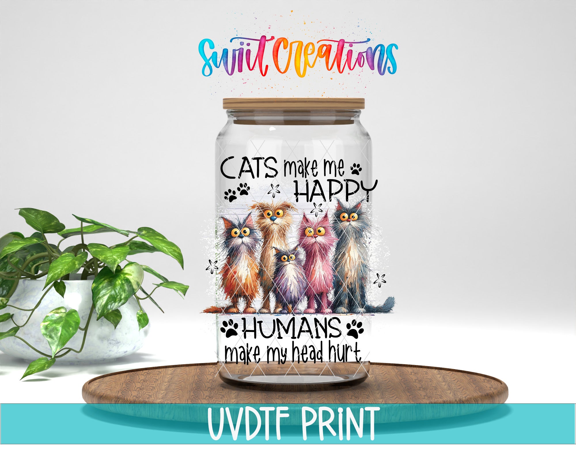 A glass jar with a label featuring a group of cats and the text "CATS make me happy humans make my head hurt" printed on it. The jar is placed on a wooden surface, and there is a potted plant in the background.