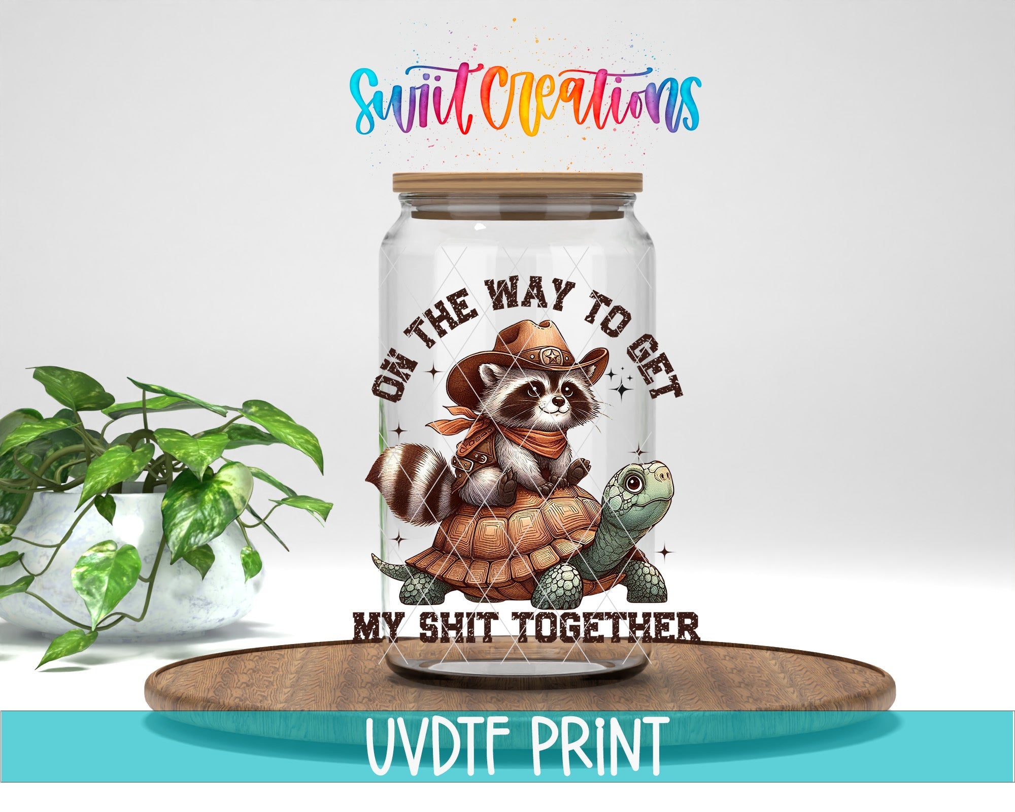 a glass jar with a picture of a raccoon on it