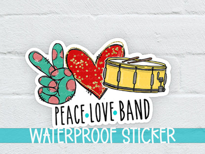 Peace Love Band sticker on a white brick background with a waterproof sticker banner