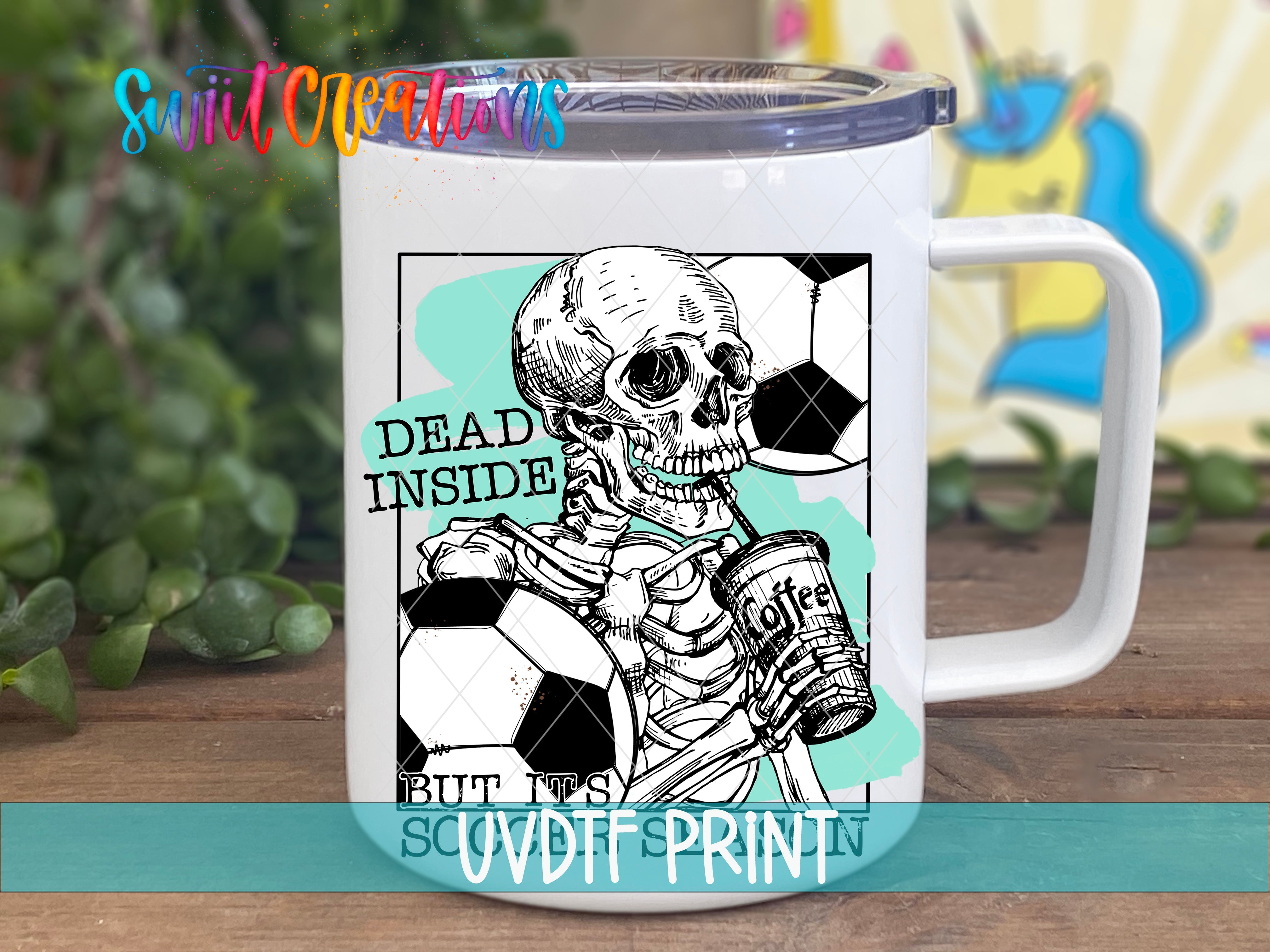 a white coffee mug with a skeleton holding a soccer ball