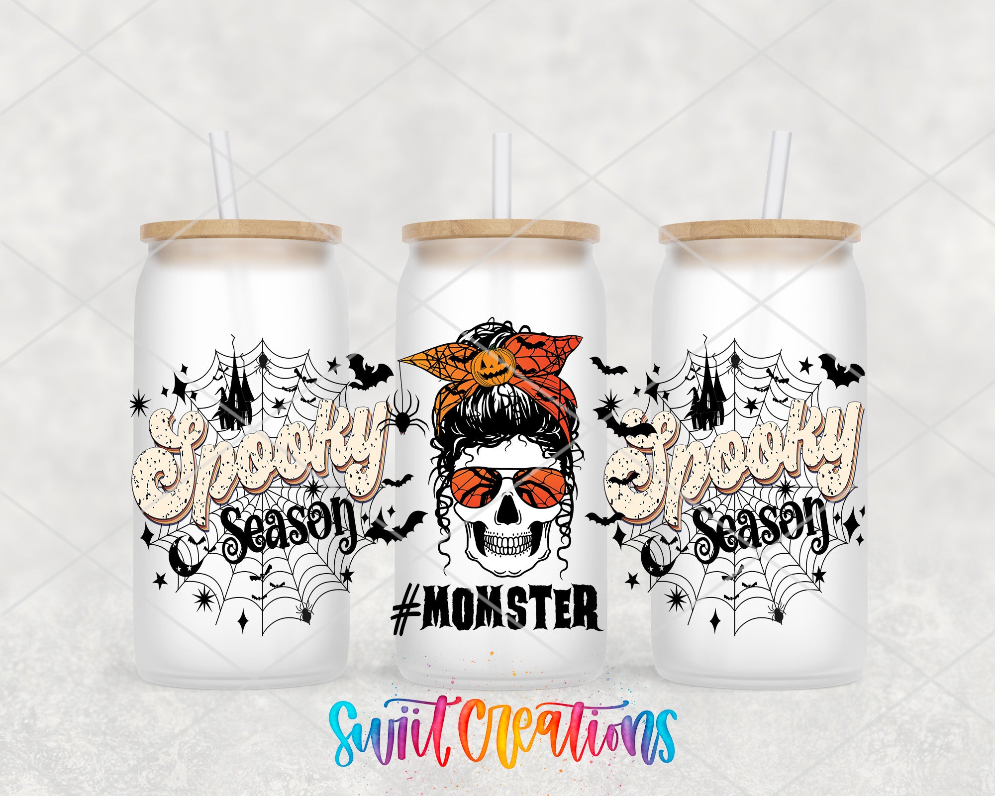 three white tumblers with Halloween-themed designs, including a skull wearing a bandana and the text "Spooky Season" in a stylized font.