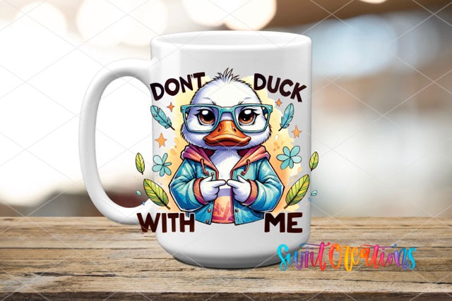 a white coffee mug with a cartoon duck wearing glasses