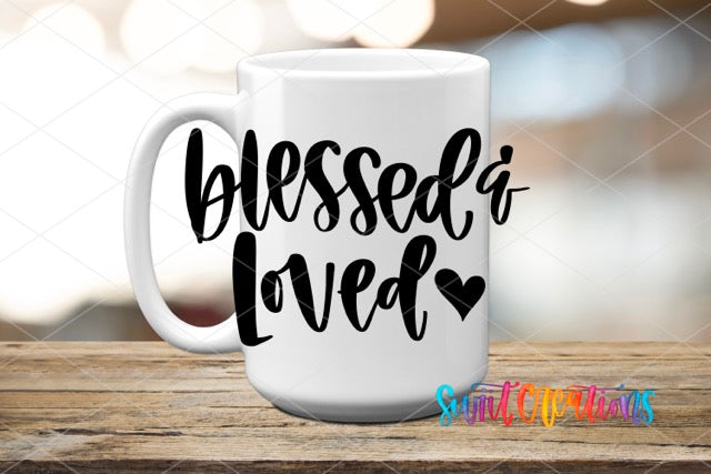 a white coffee mug with the words blessed loved on it