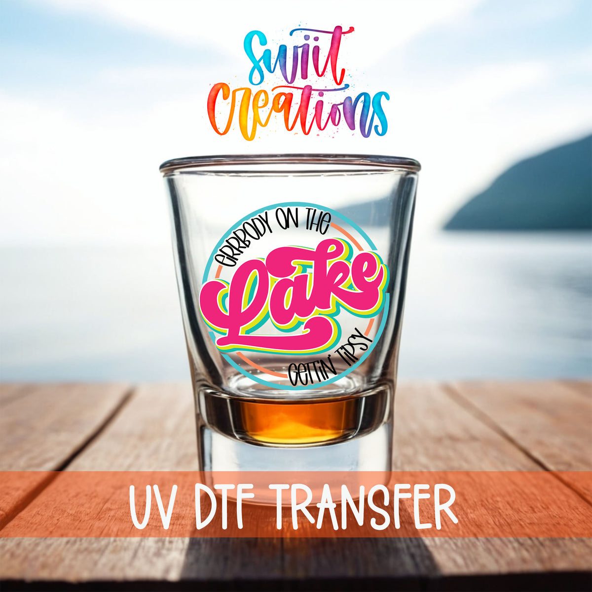 Everybody on the Lake Gettin Tipsy shot glass UV DTF transfer on a filled shot glass on a dock by the water