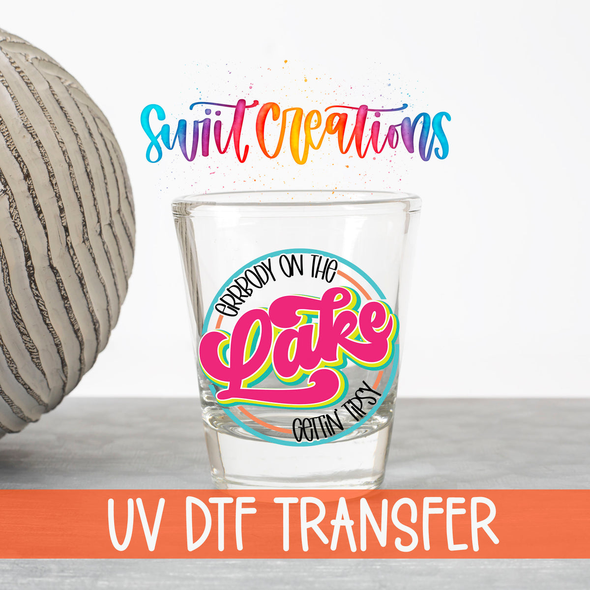 Everybody on the Lake Gettin Tipsy UV DTF transfer on a clear shot glass with the Swiit Creations logo and UV DTF Transfer banner