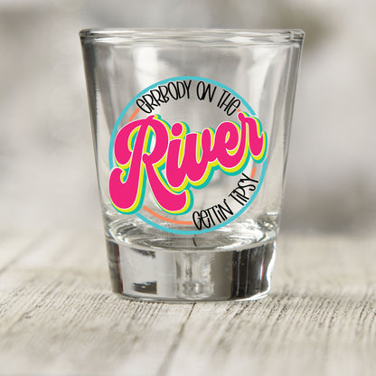 Everybody on the River Gettin Tipsy shot glass UV DTF transfer with retro script inside a circle on a clear shot glass