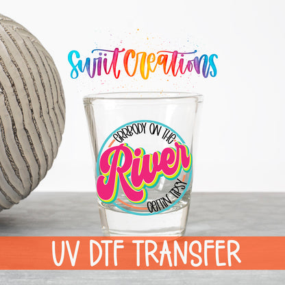 Everybody on the River Gettin Tipsy UV DTF transfer on a clear shot glass with the Swiit Creations logo and UV DTF Transfer banner