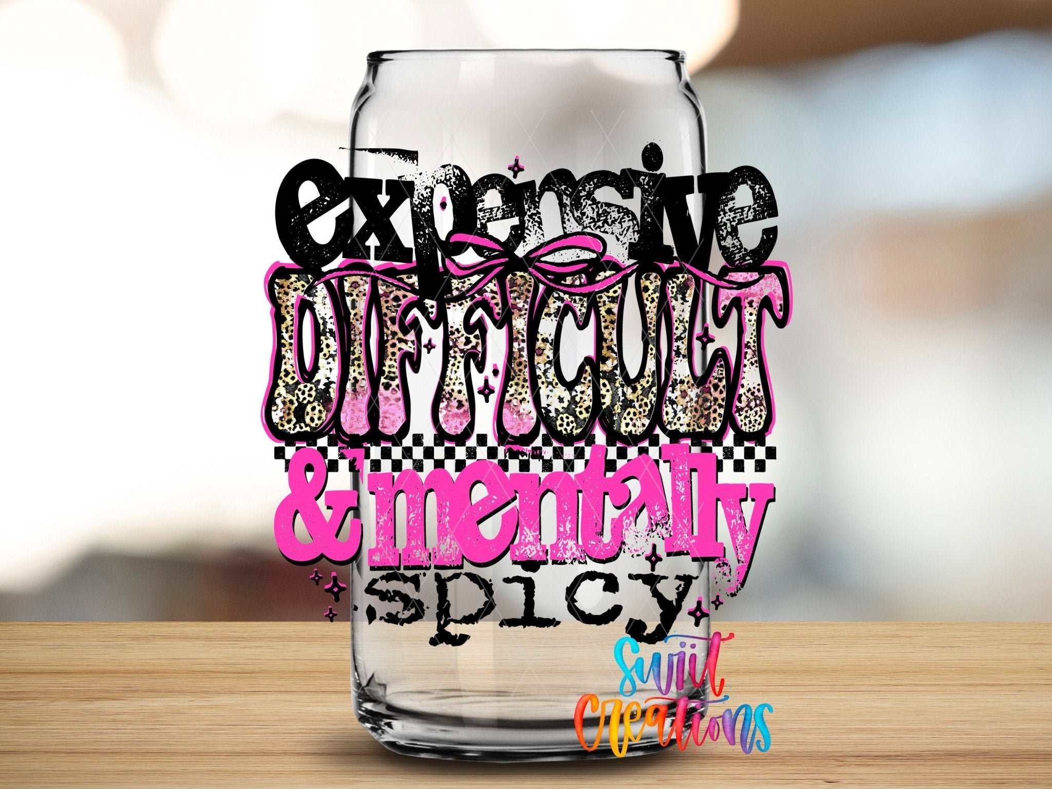 Expensive Difficult And Mentally Spicy Sassy Quote UV DTF transfer applied to a clear glass can from Swiit Creations