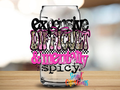 Close-up of the Expensive Difficult and Mentally Spicy UV DTF transfer on a clear glass can