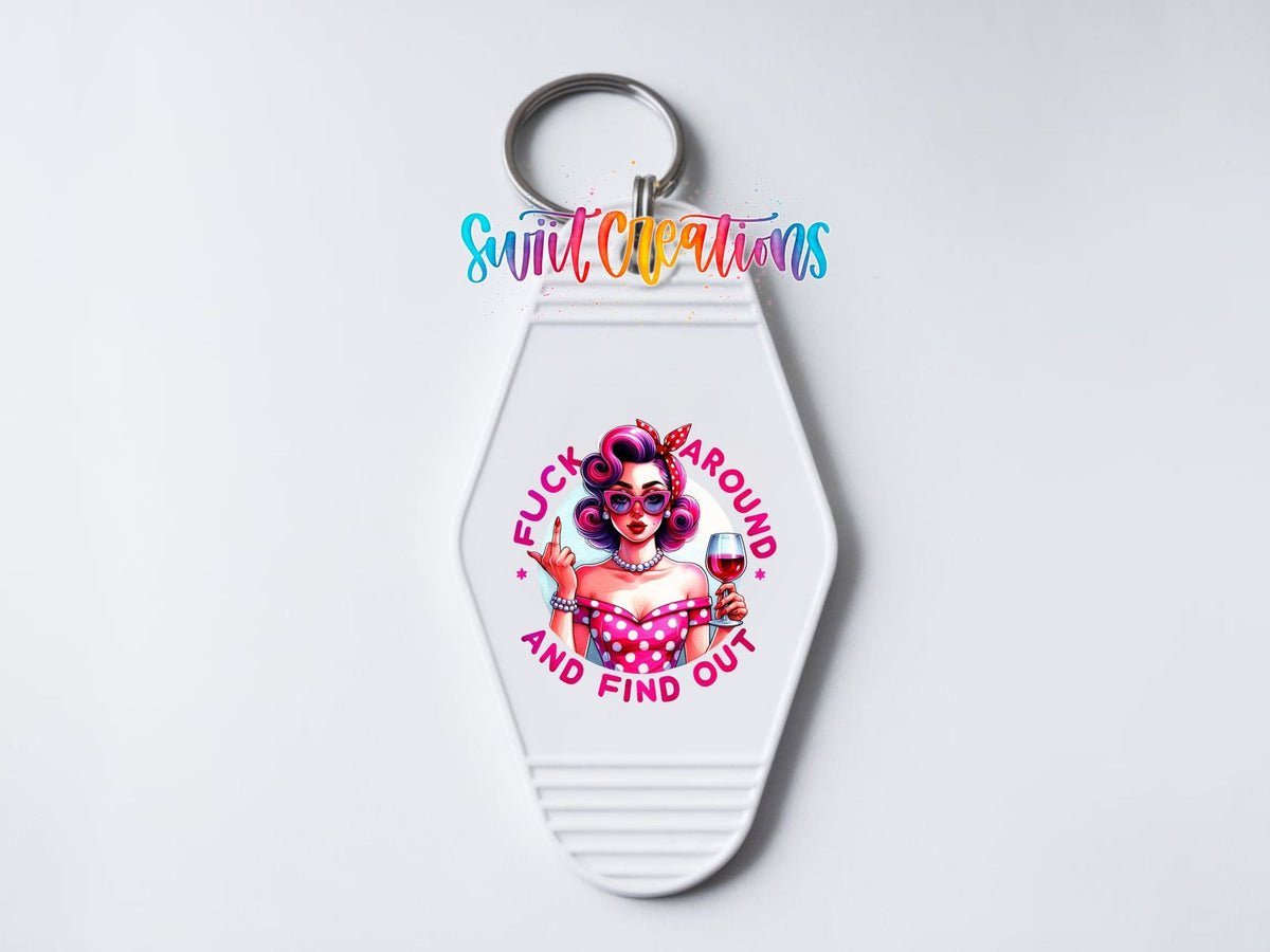 Close-up of the F*ck Around and Find Out UV DTF transfer on a white motel keychain