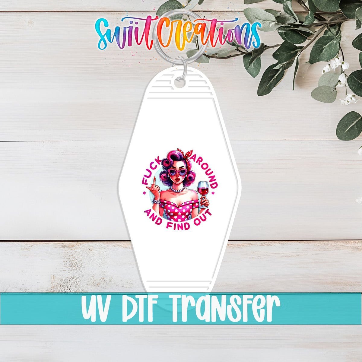 F*ck Around and Find Out UV DTF transfer on a white motel keychain on a white wood table