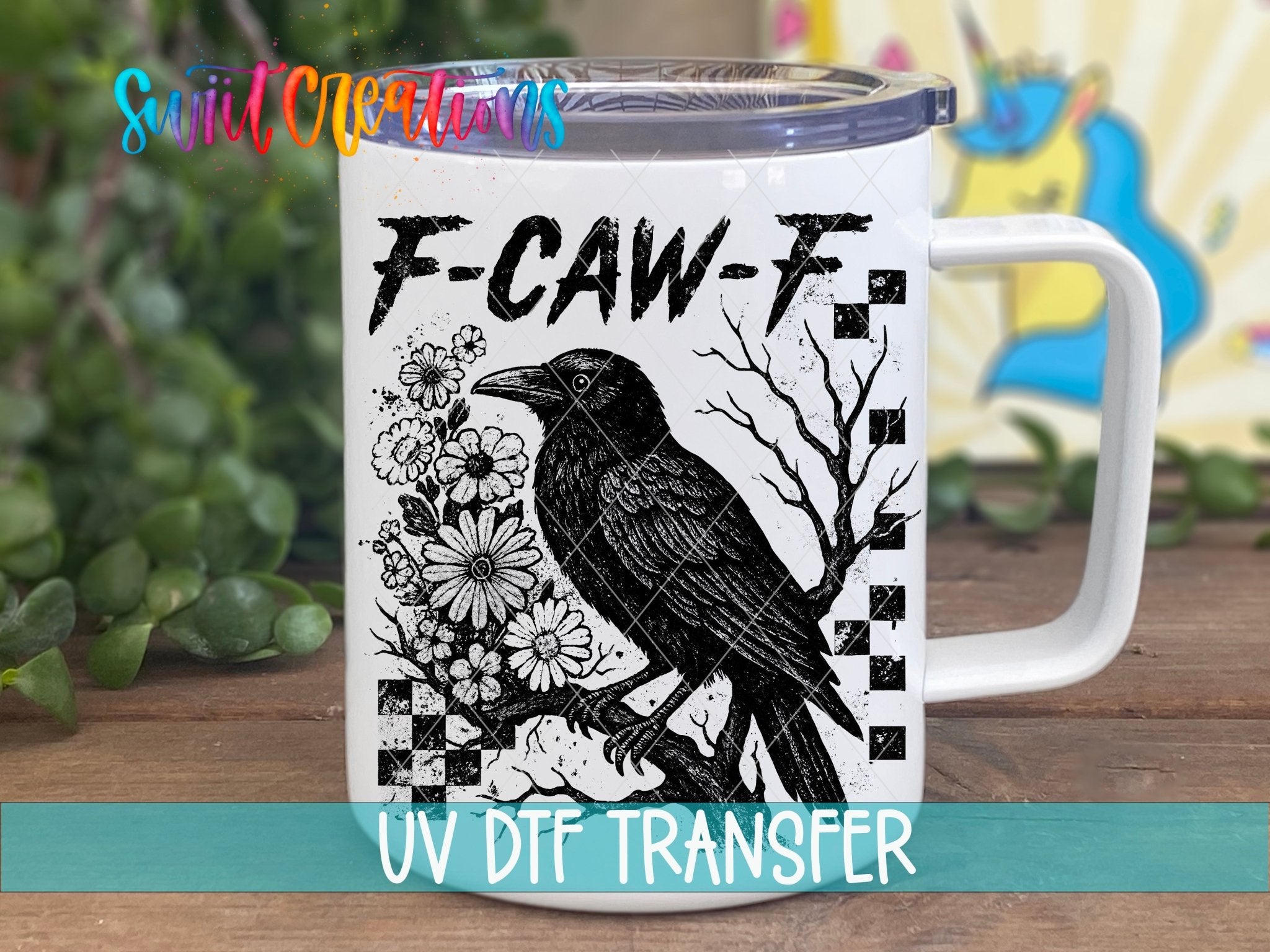 F-CAW-F Raven Gothic UV DTF transfer displayed on a white coffee mug from Swiit Creations