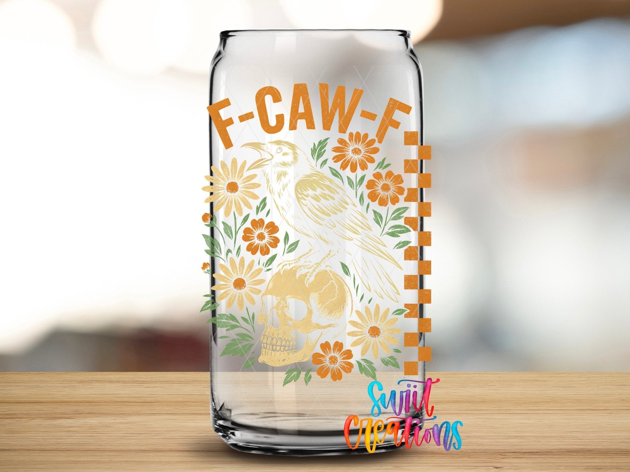 F Caw F Raven Skull Sassy Floral UV DTF transfer applied to a clear glass can from Swiit Creations