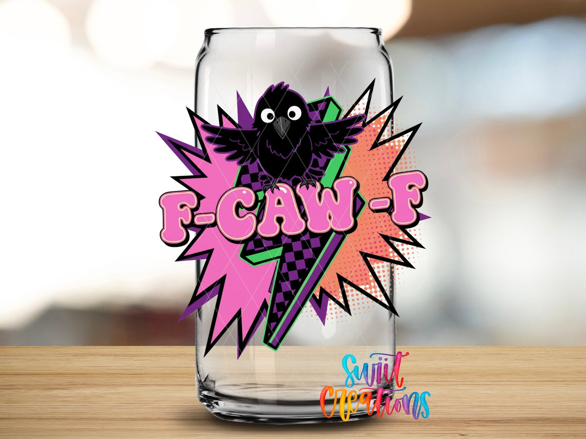 Close-up of the F-CAW-F pop art crow UV DTF transfer on a clear glass can