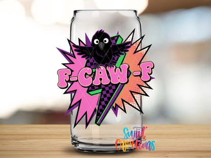 Close-up of the F-CAW-F pop art crow UV DTF transfer on a clear glass can