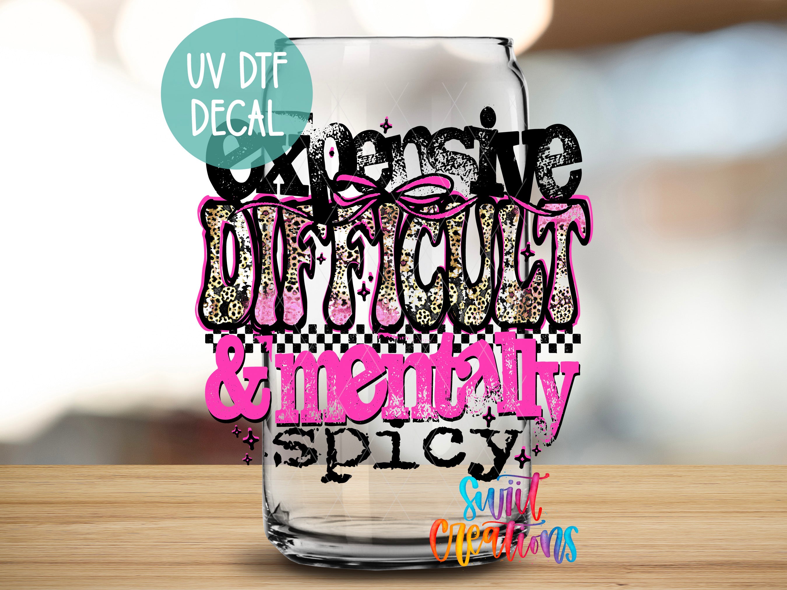 a glass with a stylized text design on it, which appears to be a creative and artistic representation of the words "expensive", "difficult", "mentally spicy", and "spicy".