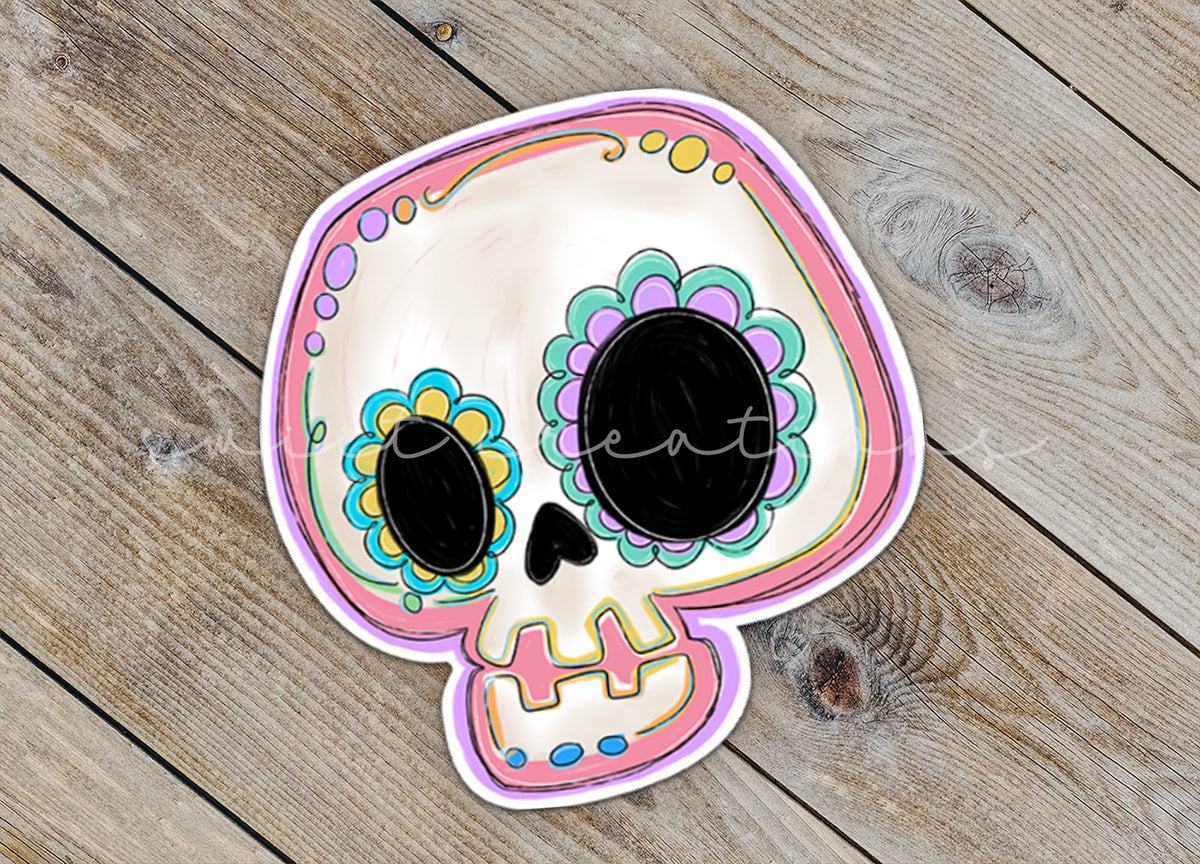 Close-up of the Pastel Sugar Skull sticker on rustic wood