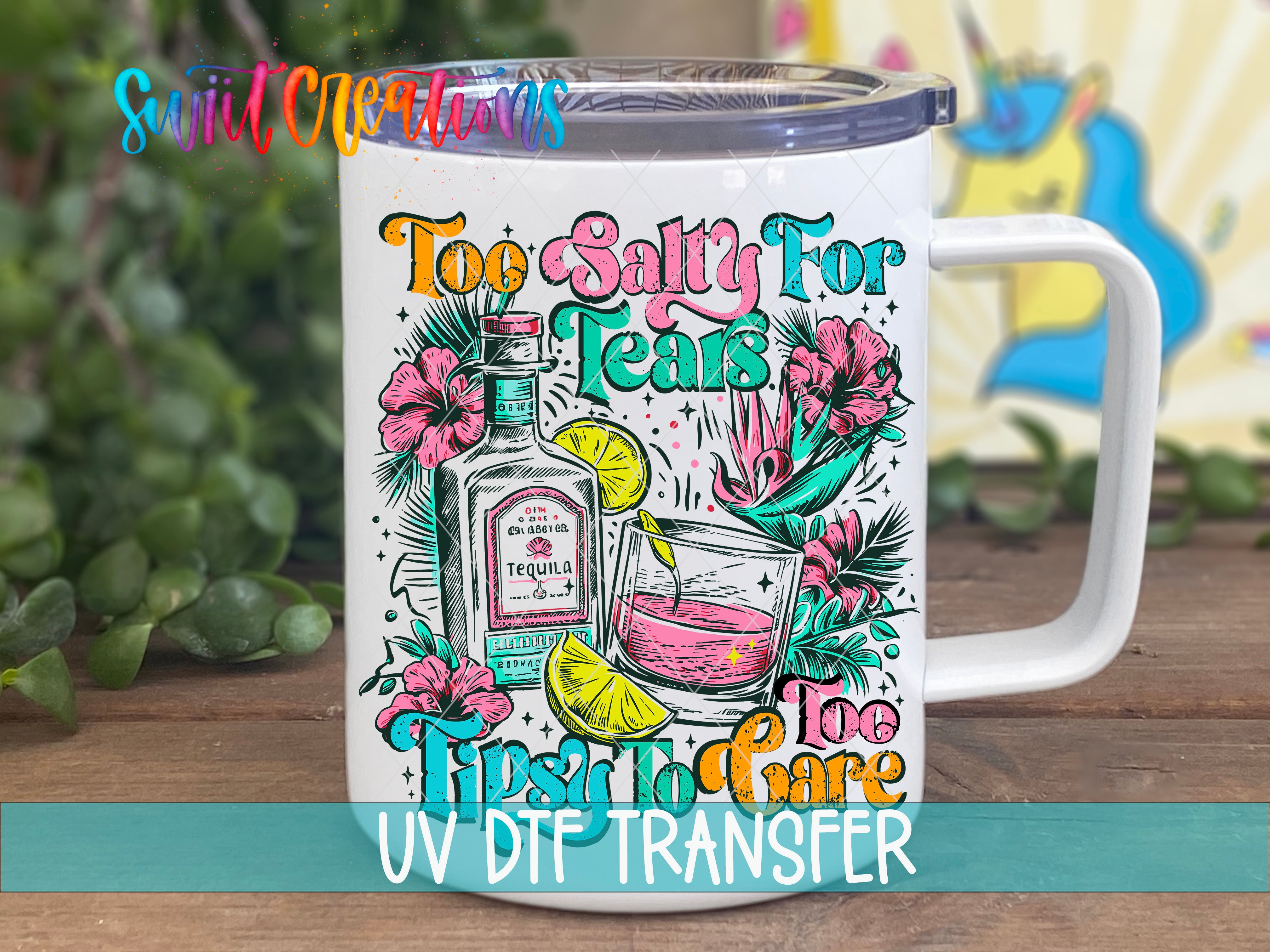 A white mug with a colorful graphic design featuring a tequila bottle, a tequila glass, and various tropical flowers and leaves. The text on the mug reads "Toe Salty For Tears Tipsy To Share UV Dtf Transfer".